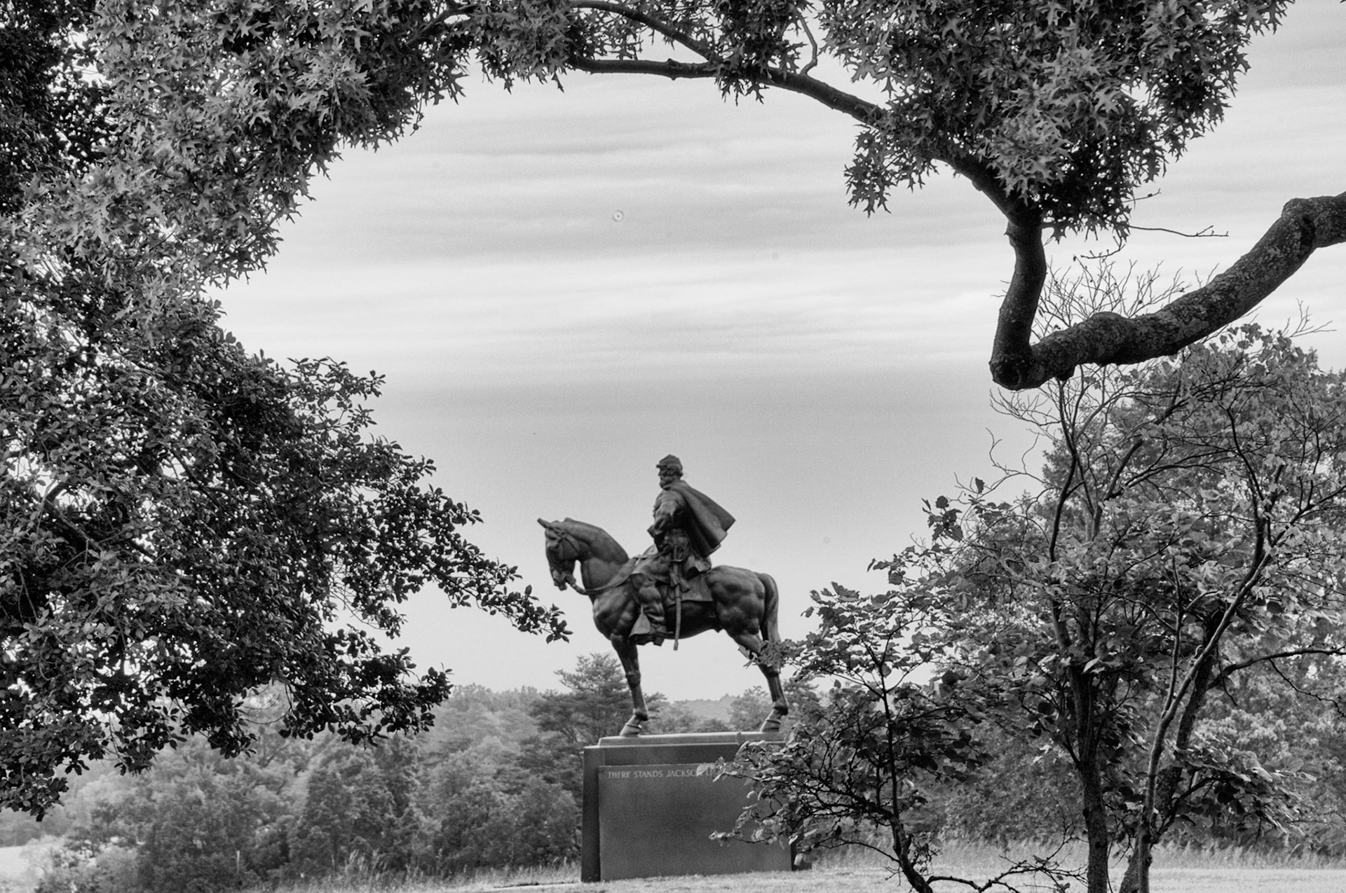 There stands Jackson like a stone wall! Rally round the Virginians! ~ Barnard Bee. While it was a very overcast and lightly rainy day, this framed view caught my eye as I was walking back to the car to leave Monassas. Somehow that dark, drab, flatly light day made for a pretty nice image.