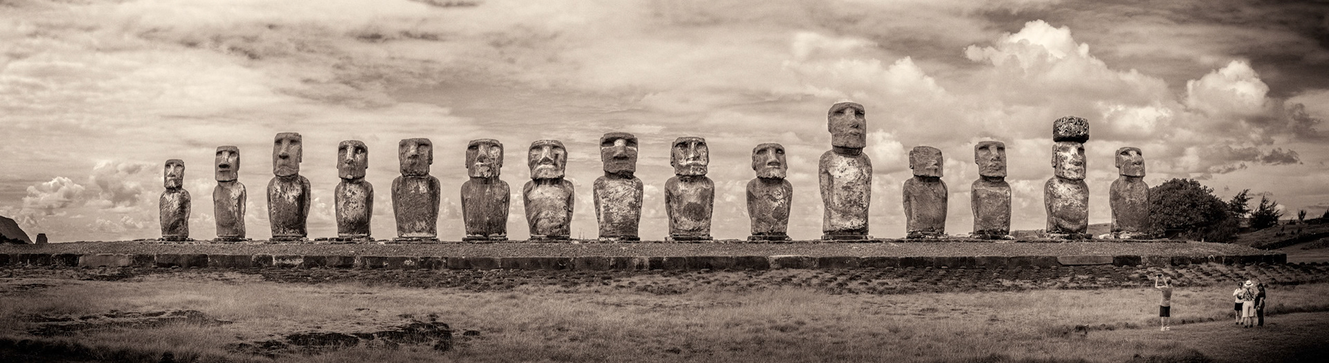 The coastal Moai's are facing inland. Note fellow visitors image right for scale. These were a short trip from the quarry in next photo