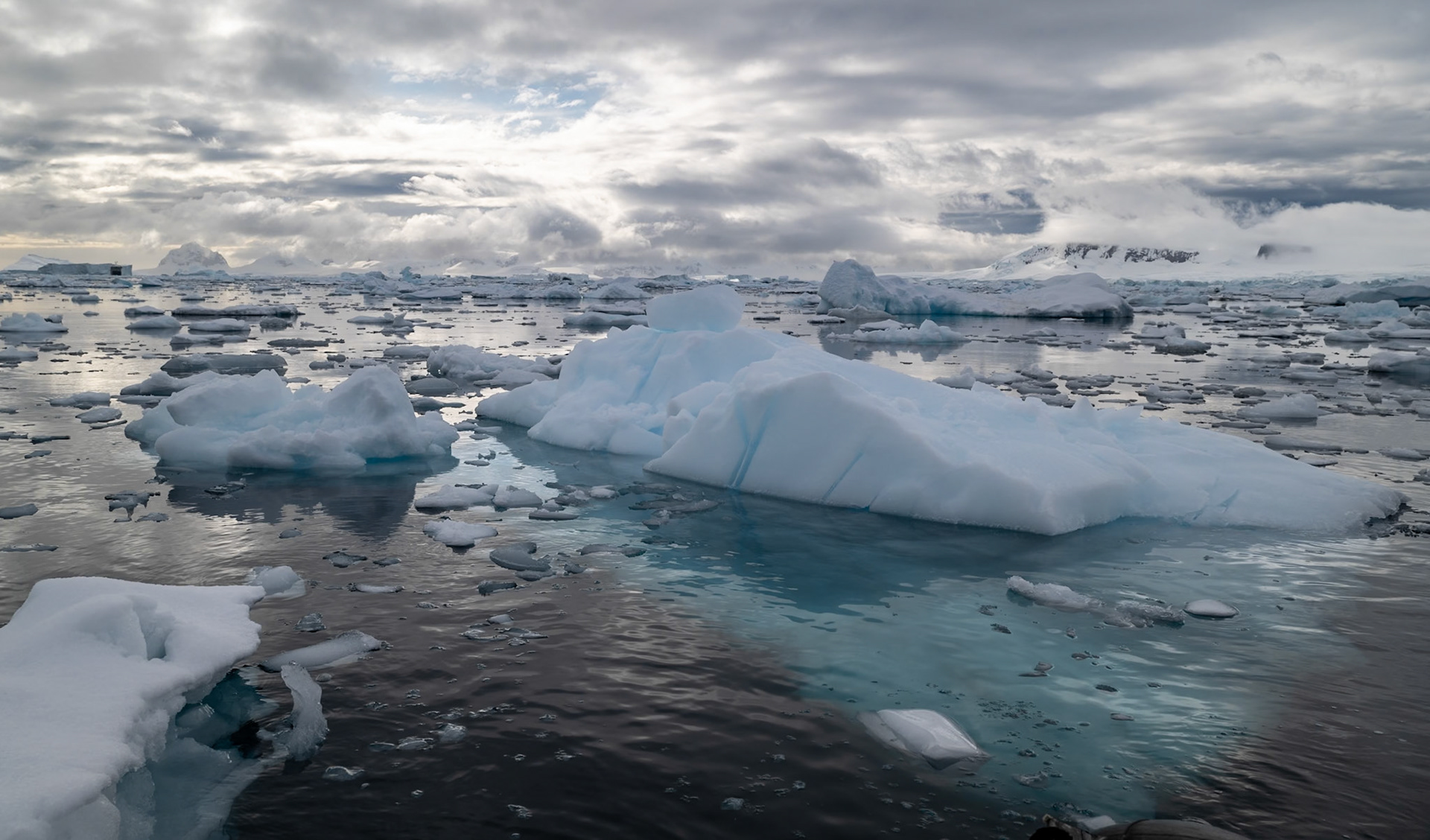 The small black blob far left is the Magellan - and the iceburg it's infront of is taller...10% above 90% below is a general guide