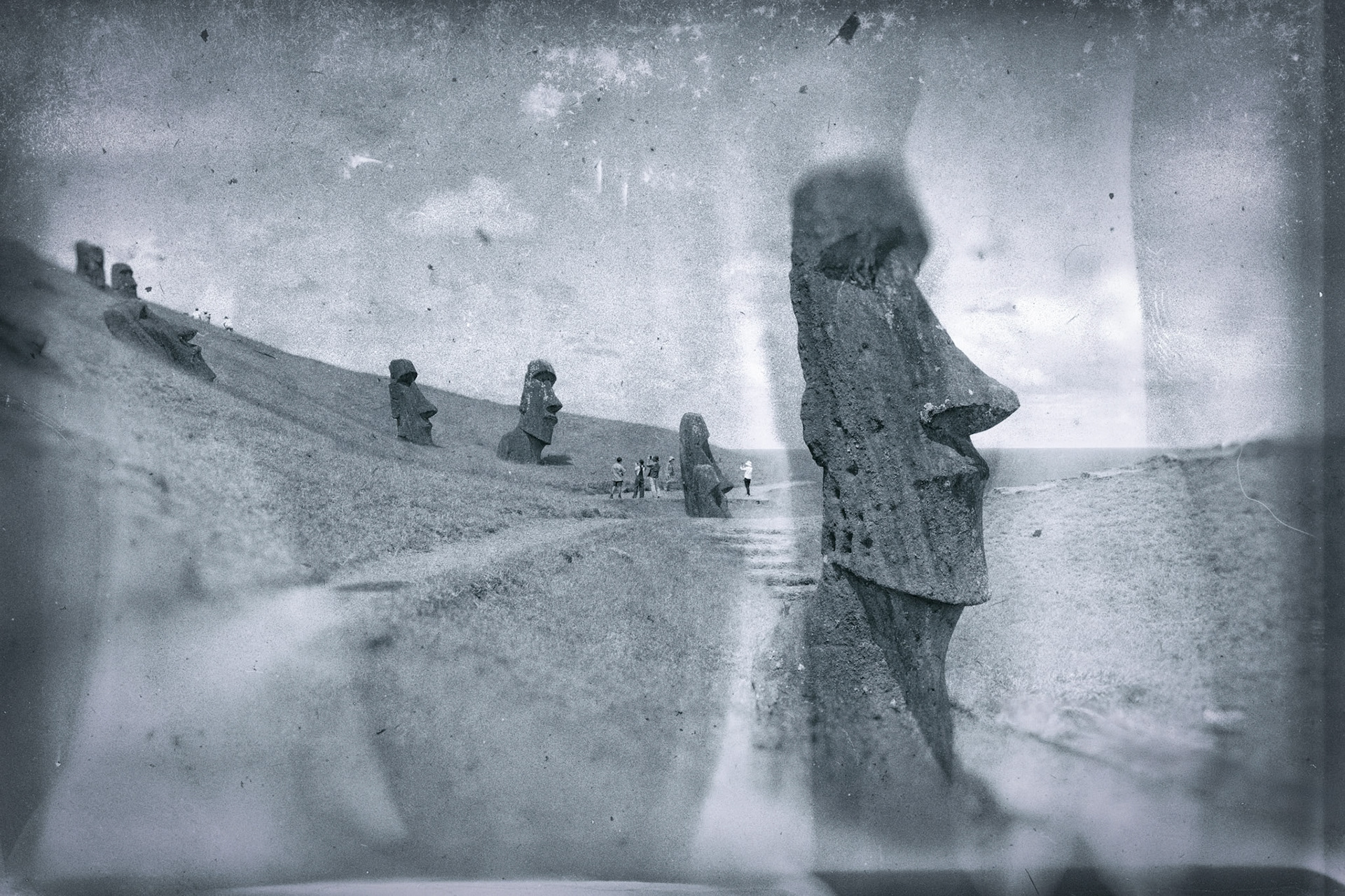 What appear to be holes on the cheek is damage from musket fire c.1900. Sailors using the Moai for target practice.