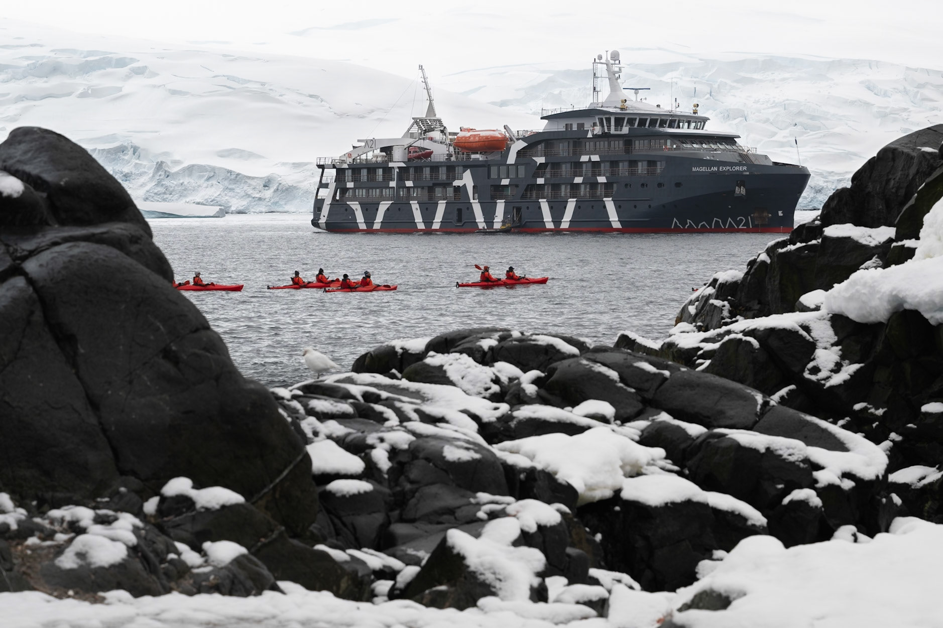 Kayakers try to catch up to the Magellan Explorer before she weighs anchor :-D