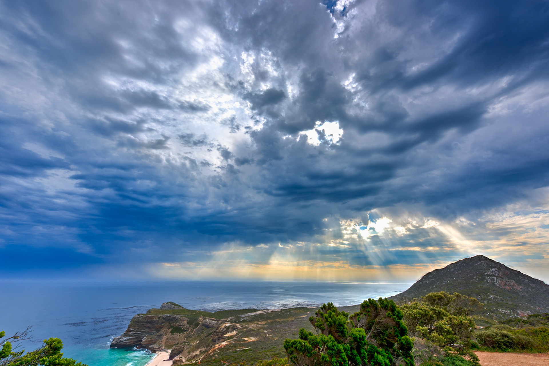 The sun tries to break through the clouds at the Cape of Good Hope, South Africa