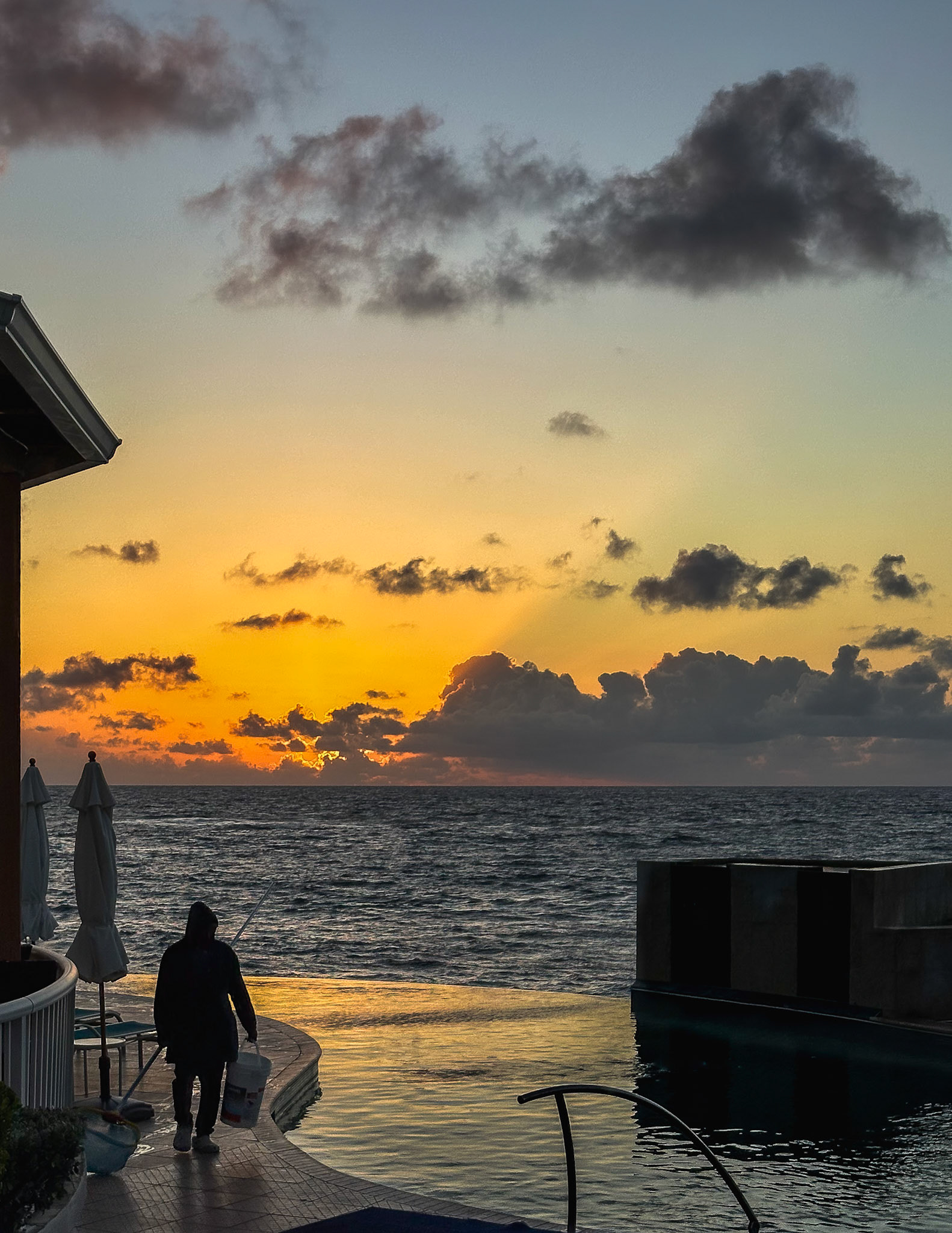 Just the pool guy and I taking in a terrific sunrise at Oyster Bay Beach Resort