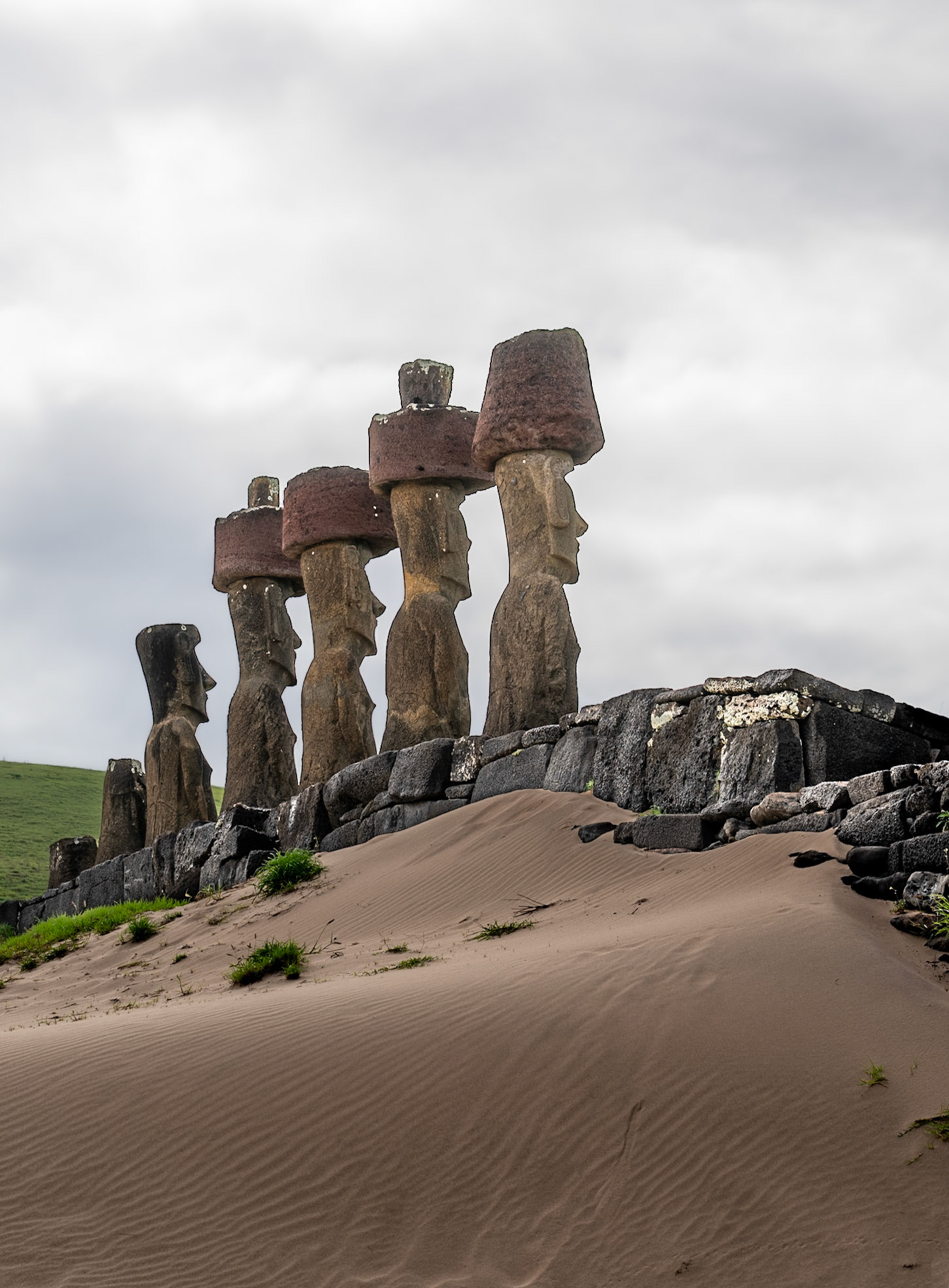 Note the red Pukao topknots, and they're asymmetrically balanced on the heads. Makes for an interesting task of balancing these after the Moai is stood in place.