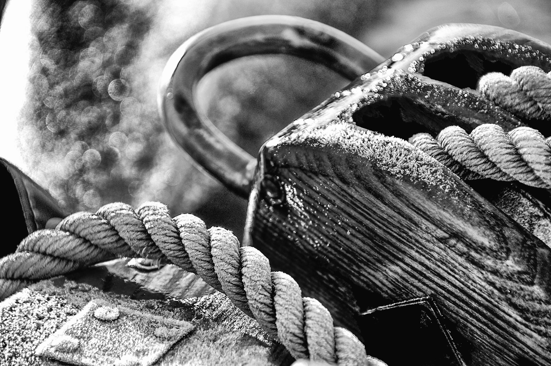 Early morning light and a heavy frost on hemp rope and wood block &amp; tackle abroad the River Queen on the Main River in Germany.