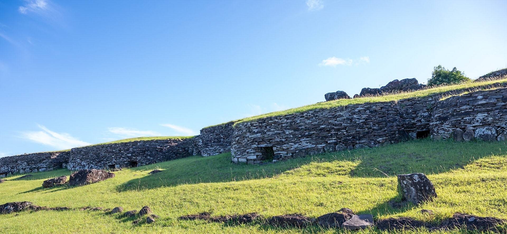 Entrances to the stacked stone and sod covered living units on the coast.