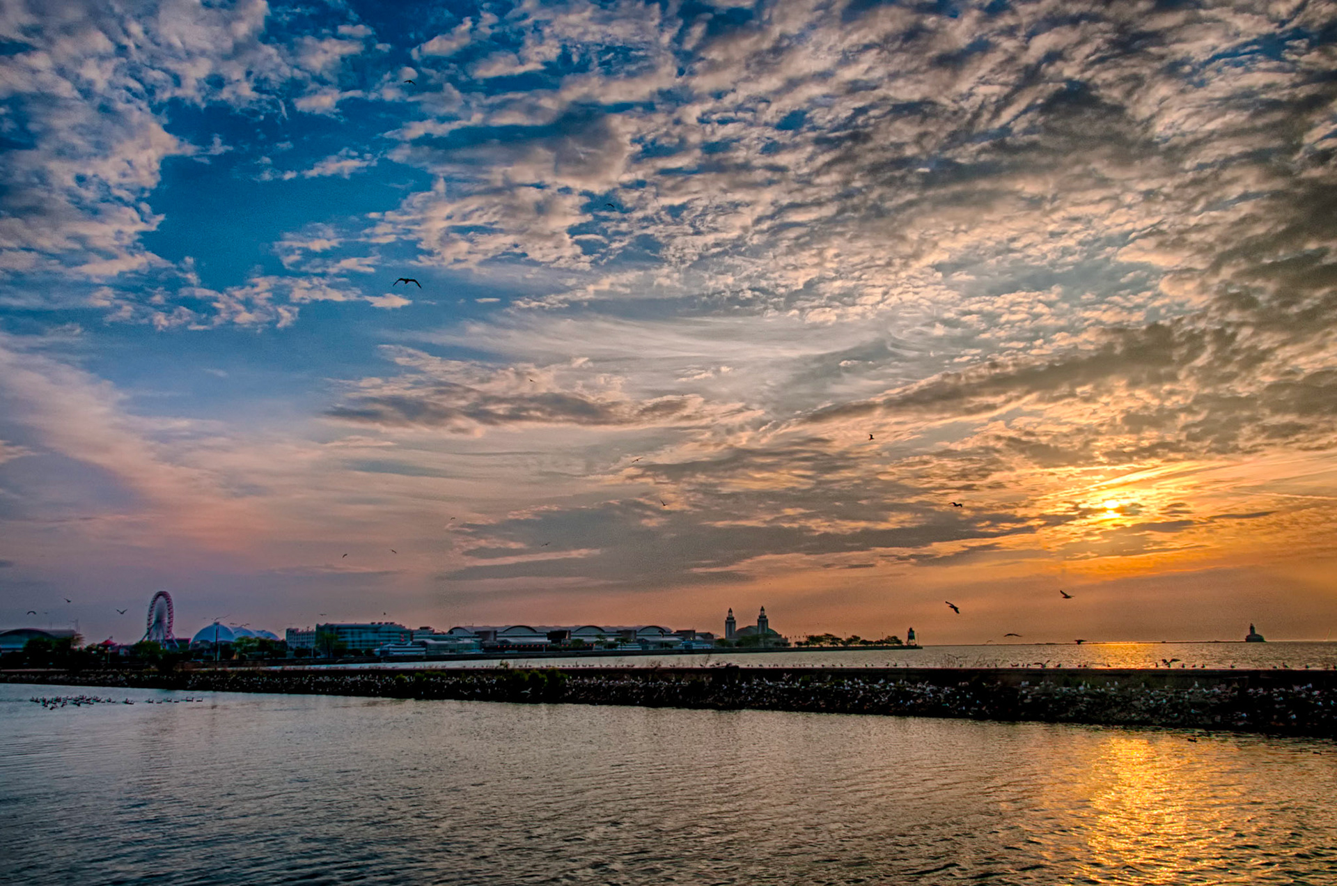 It's always worth getting up early, before sunrise, and start walking about to get a sense of a city.  Navy Pier as the sun rises on Lake Michigan in Chicago didn't disappoint.