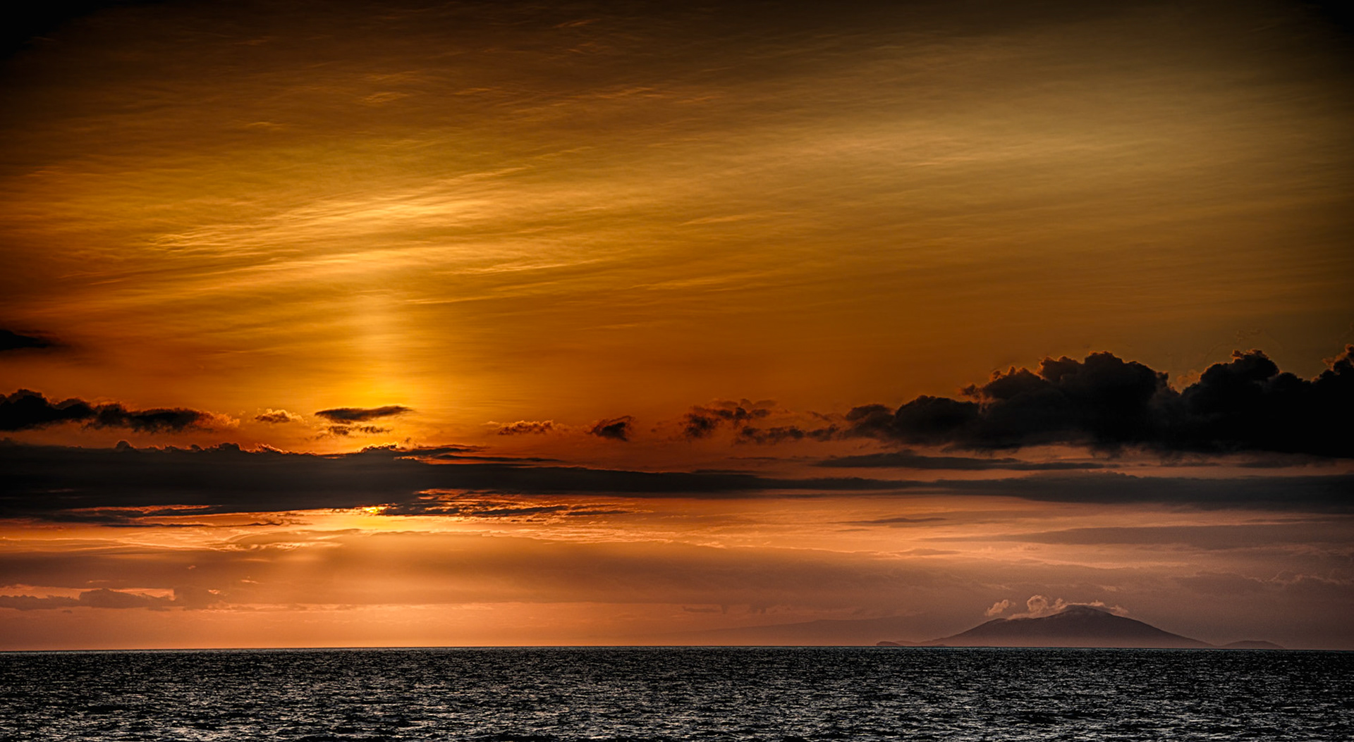Yes - the sky really was that orange. Yet another brilliant Galapagos island sunset in the South Pacific.