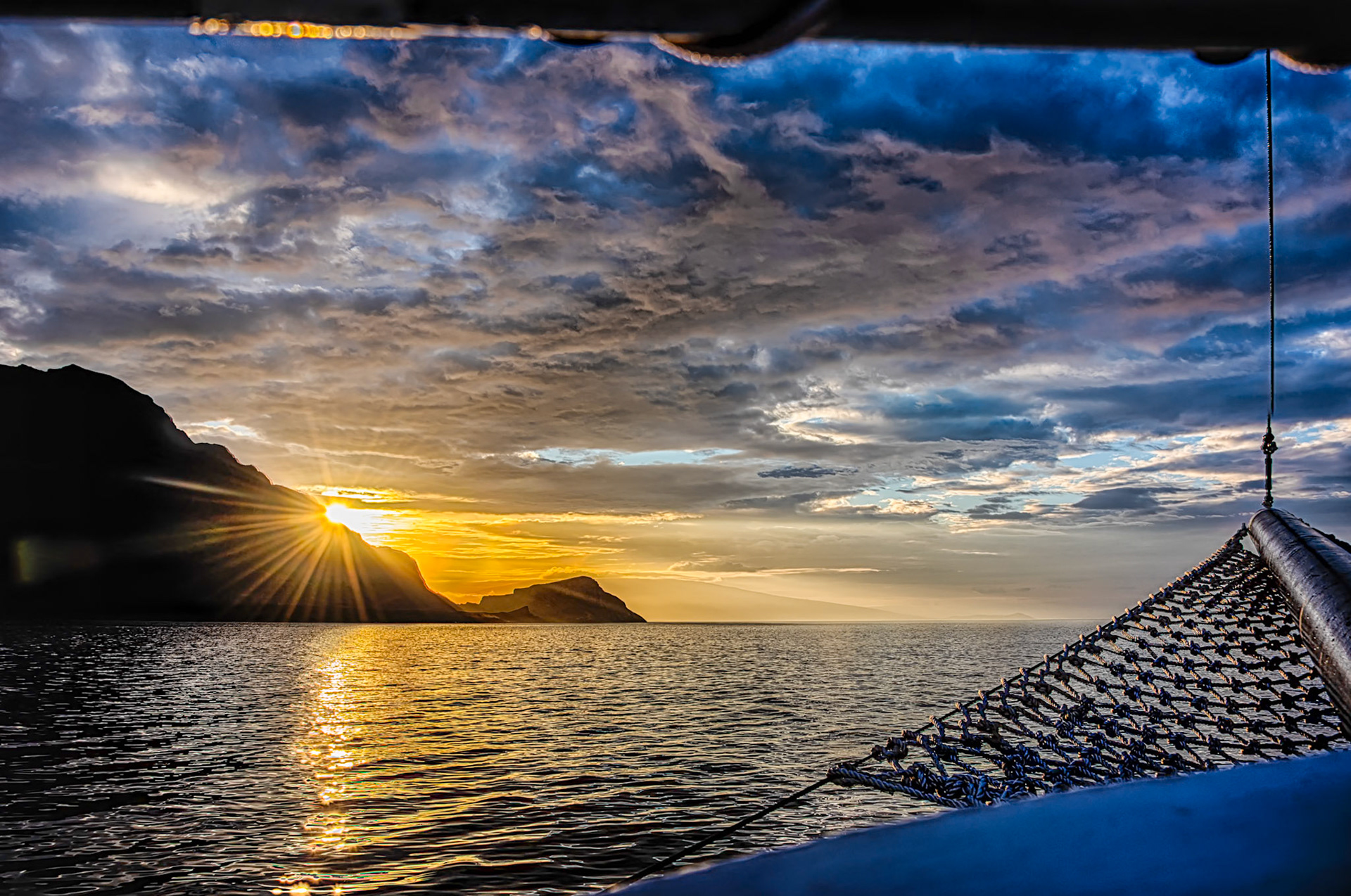 Yes - the sky really was that orange. The sunrise peaks out from behind the northenr tip of Isla Isabela in the Galapsgos Islands, Ecuador.