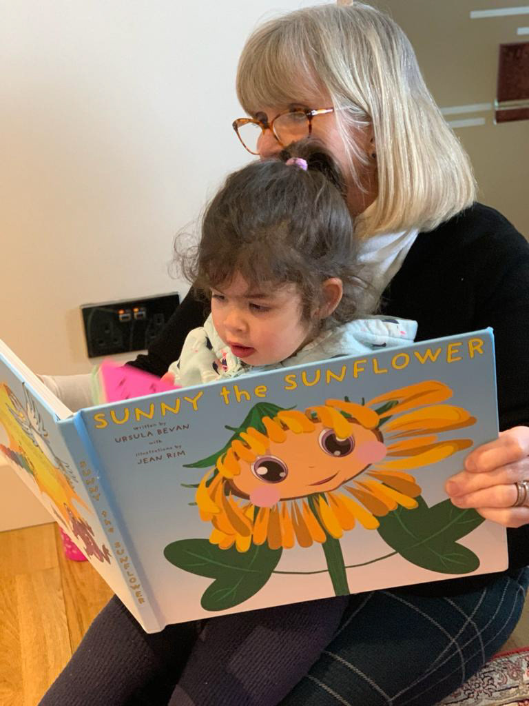 Our dear friend reading Sunny to her grand-daughter
