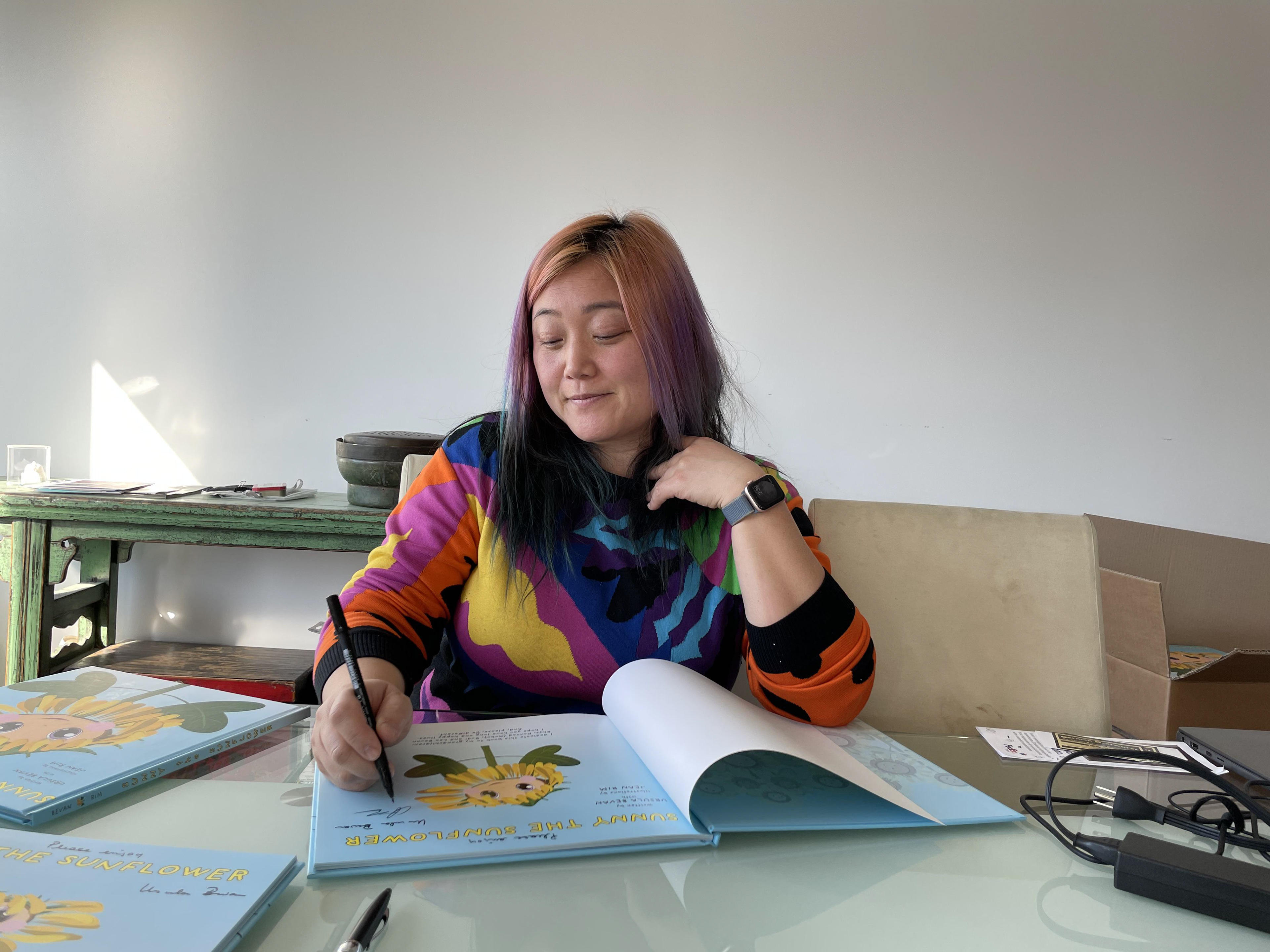 Jean signing books