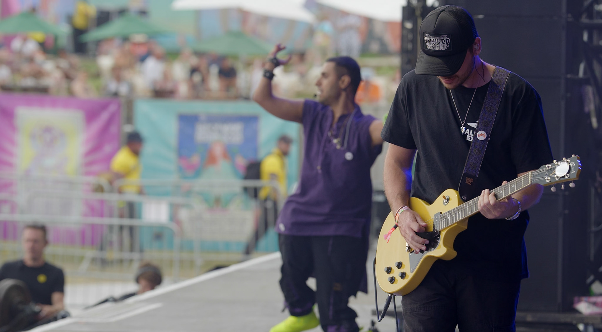 Emmanuel Kelly and Rees Cowne on stage at the Isle of Wight Festival 2025