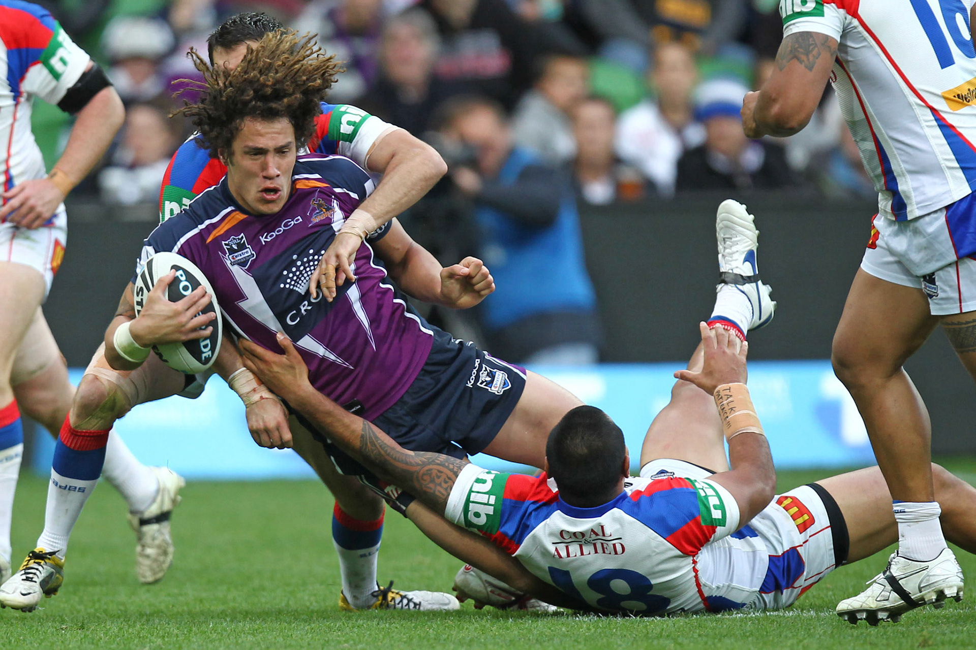 Storm's Kevin Proctor tackled:NRL, Rugby League, Qualifying Final, Melbourne Storm v Newcastle Knights at AAMI Stadium, Sunday 11th September, 2011. Digital Image by Brett Crockford © nrlphotos.com