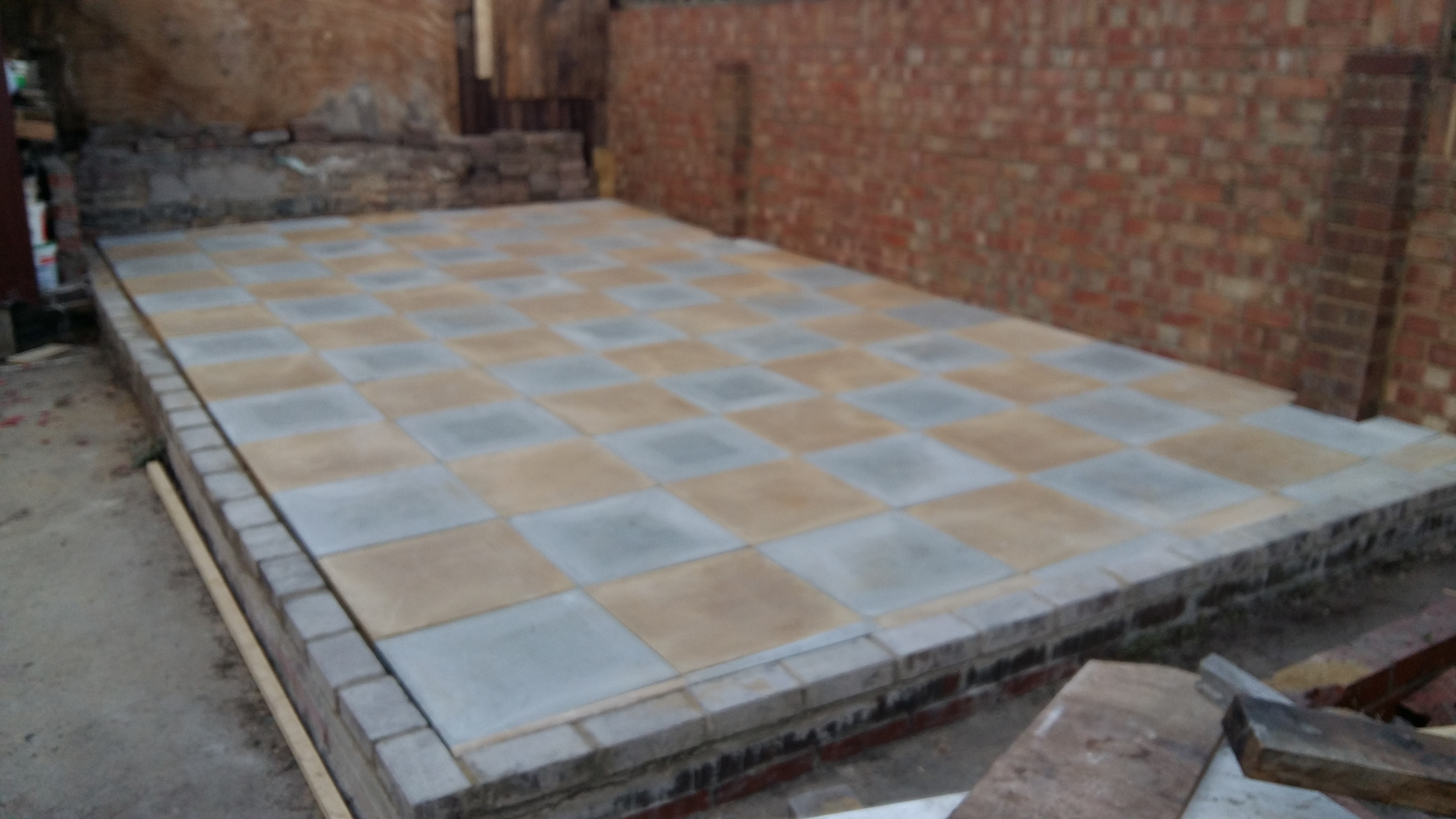 Fill in tile spacing with kilm sand.