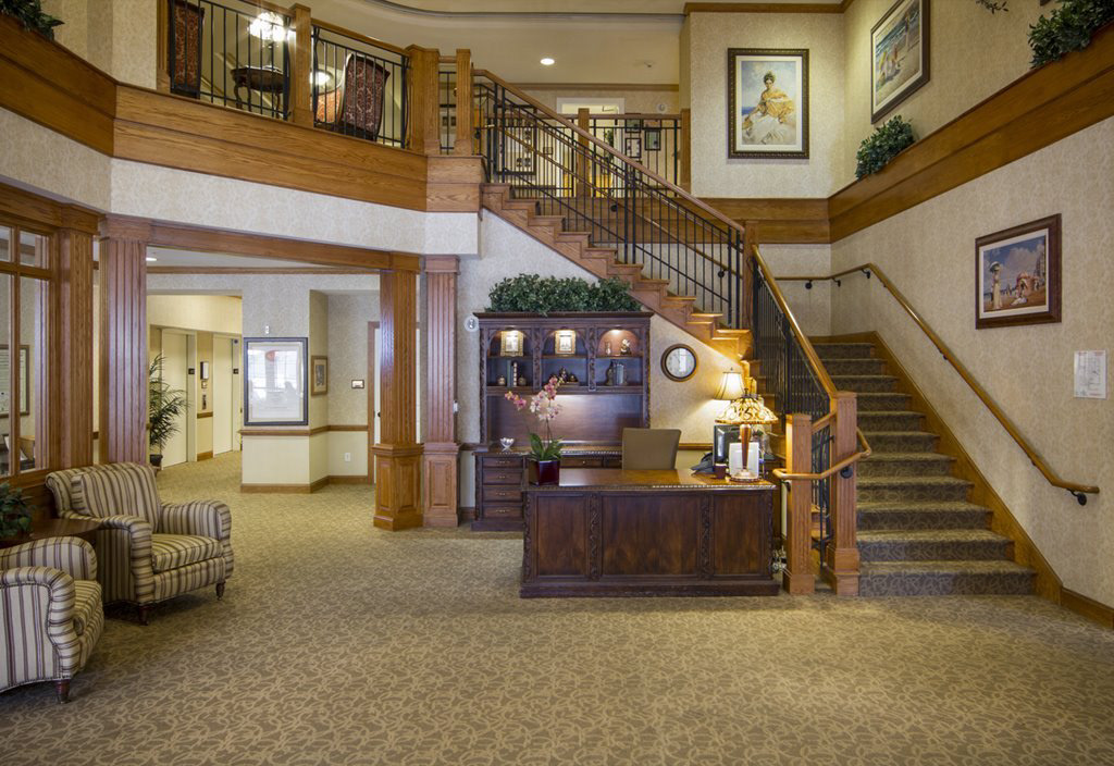 Figure 7. GRAND FOYER The foyer is the very first view when you enter this building. You can see the reception table and grand staircase.