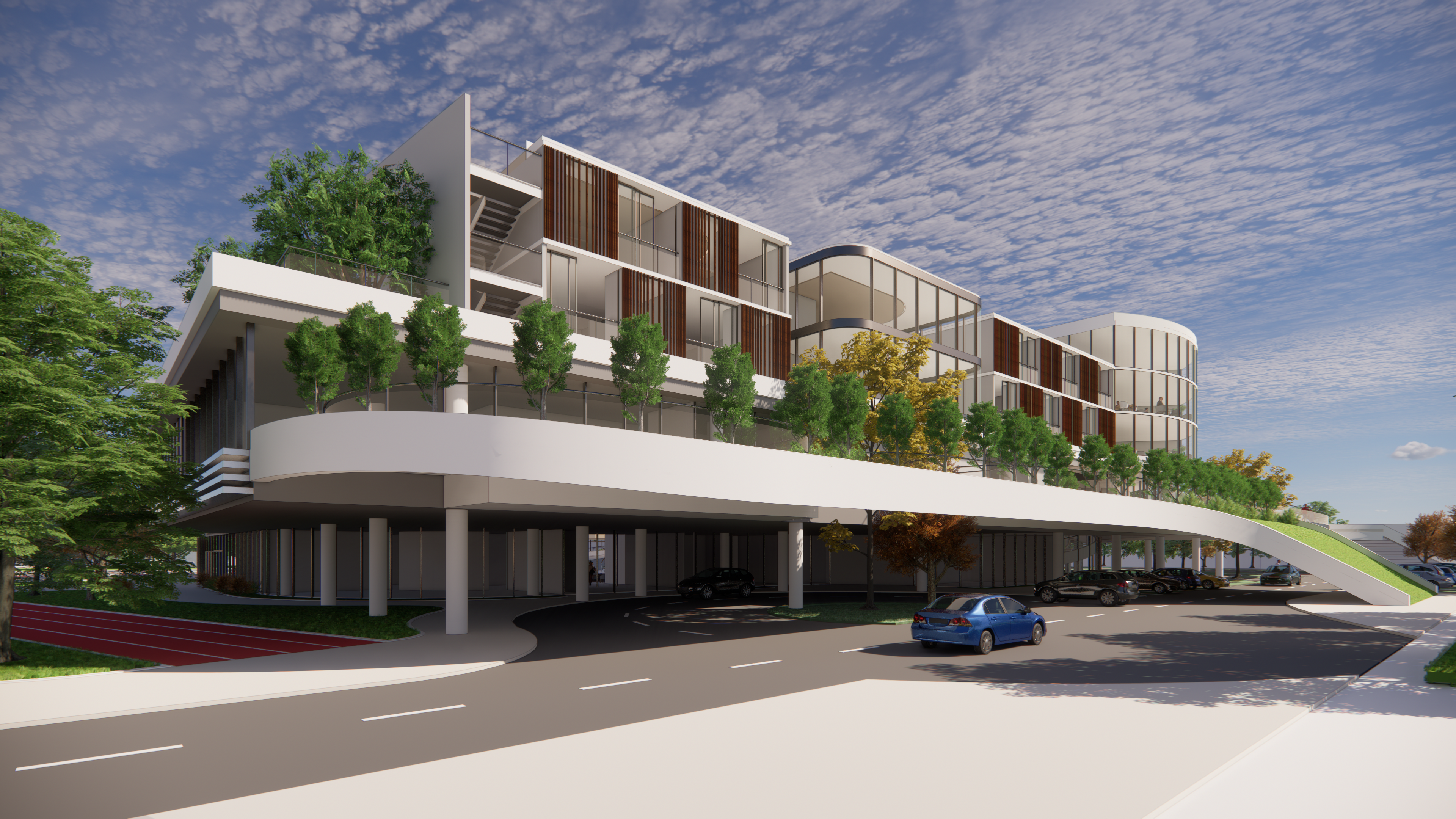 The drop-off location is linked to the COVID screening vestibule and shaded waiting area. It is visible from the street without taking up space of the pedestrian area.