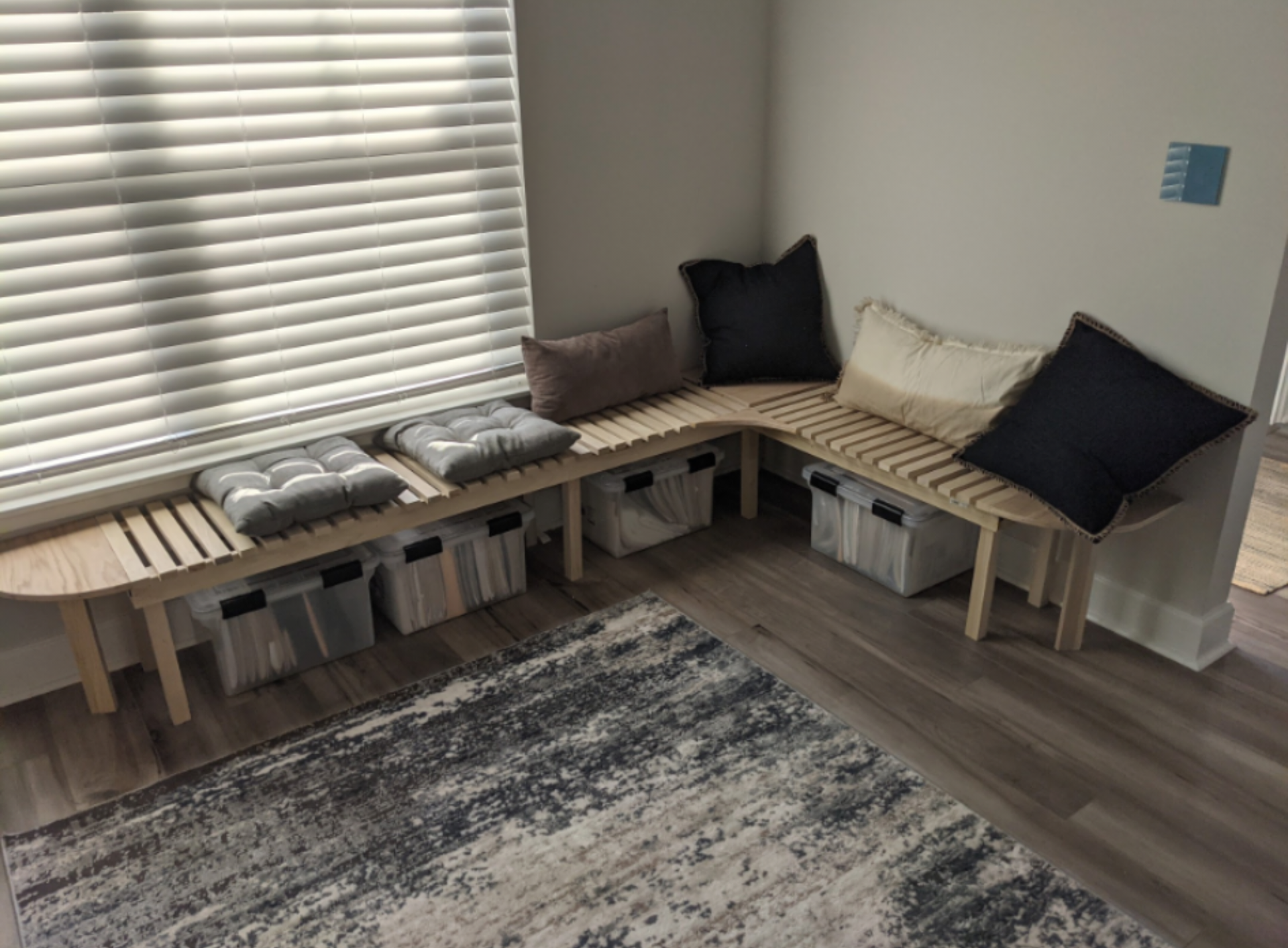 Bench created with storage in mind and seating for customers as needed. The overall design ensured space was avaialble for the bins used to store office work.