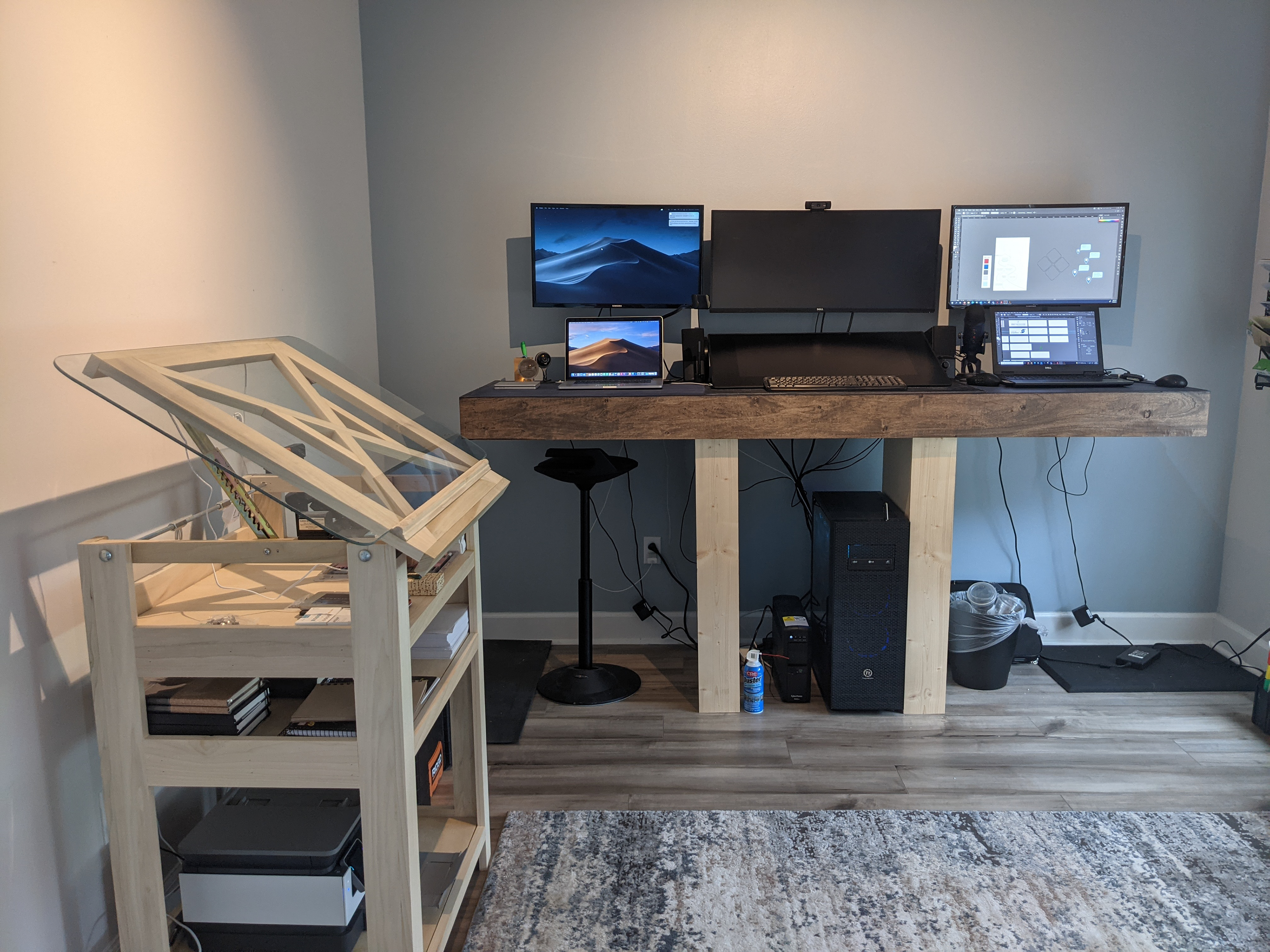 These two builds were extremely fun to make and are used on a regular in my day-to-day. The first is the stand-up primary desk which houses three systems. The drafting table also concept to design creation with coordination with the local glass company for the top piece. This product comes with back lighting and a means to raise and lower for ease of use.