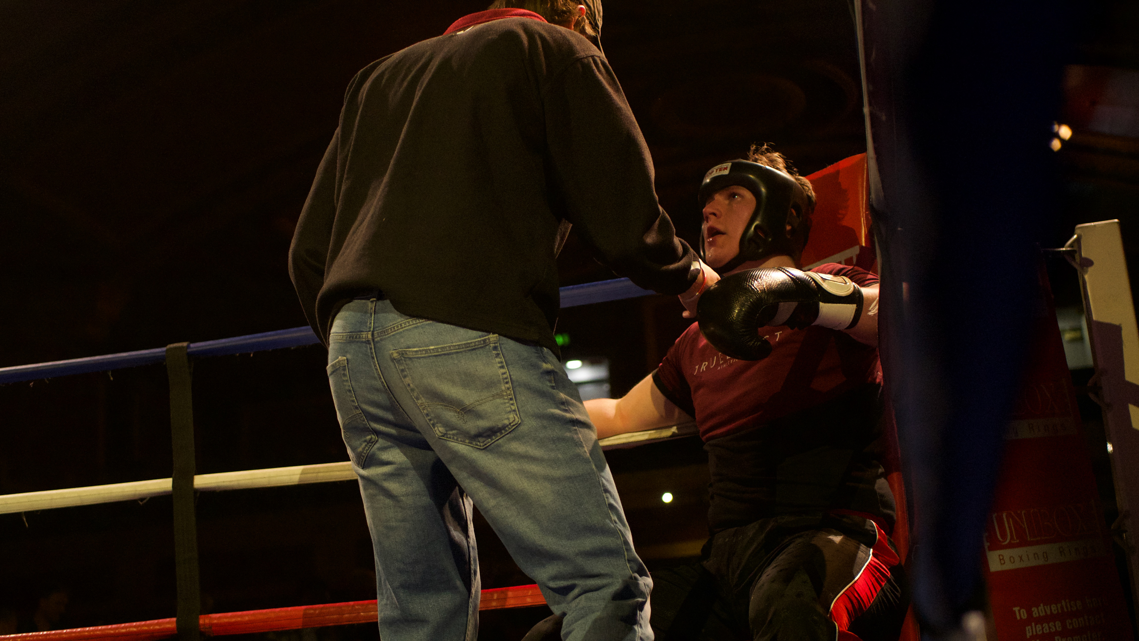 the coach providing new strategy to their fighter