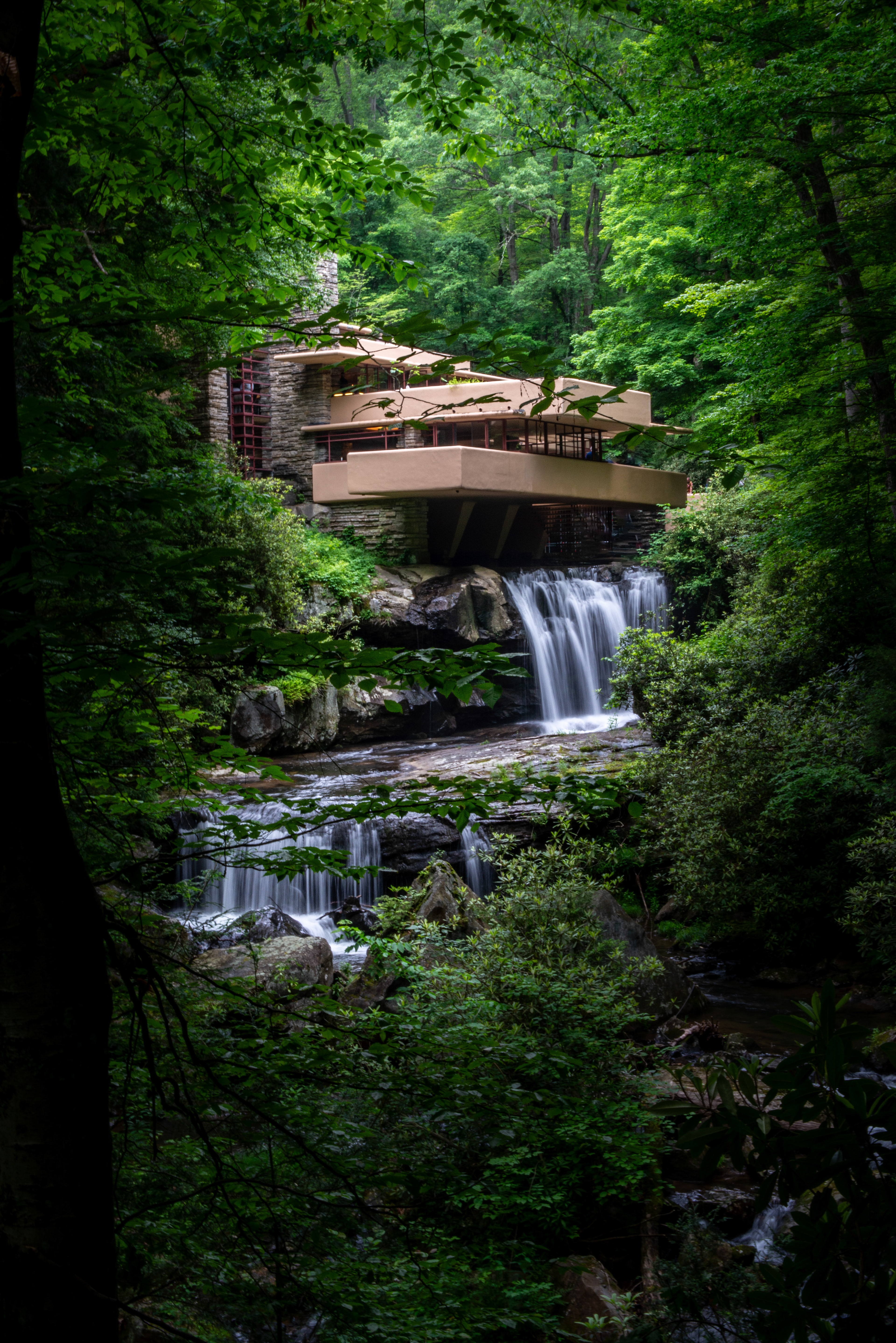 Frank Lloyd Wright's Falling Water.  Long exposure to get the blurred waterfalls. I had no tripod and was able to get a sharp image by bracing against a tree.