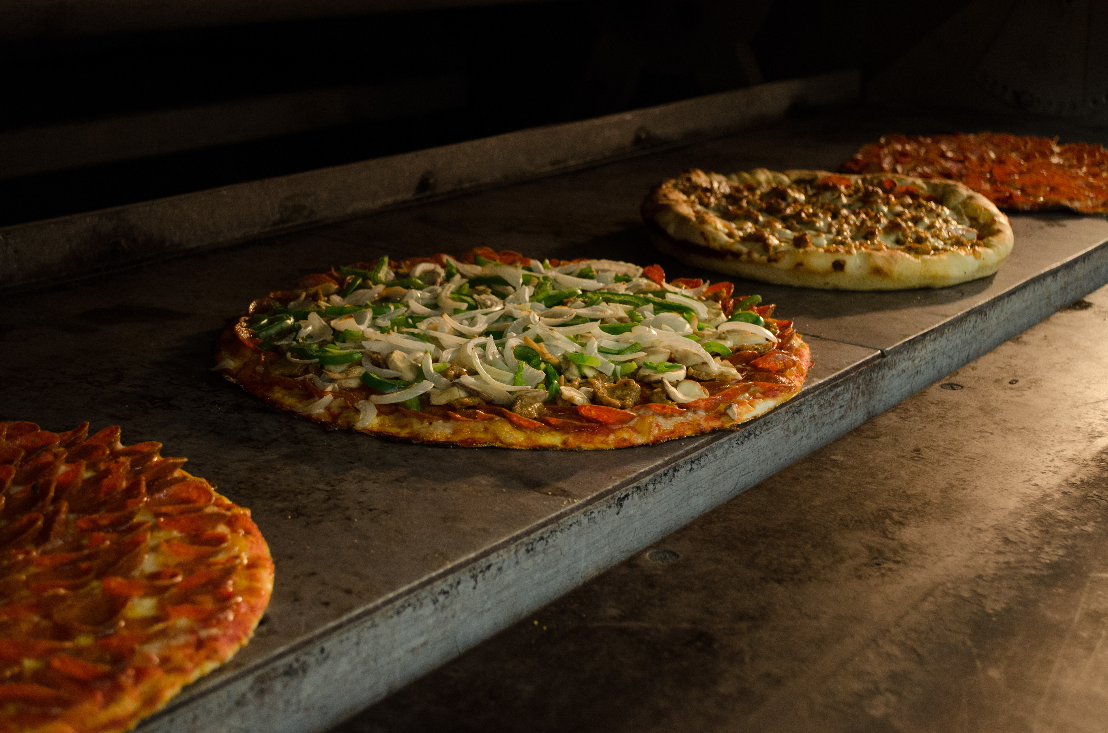 Food shoot at Massey's Pizza, Grove City, Ohio. Pizzas in the oven. 