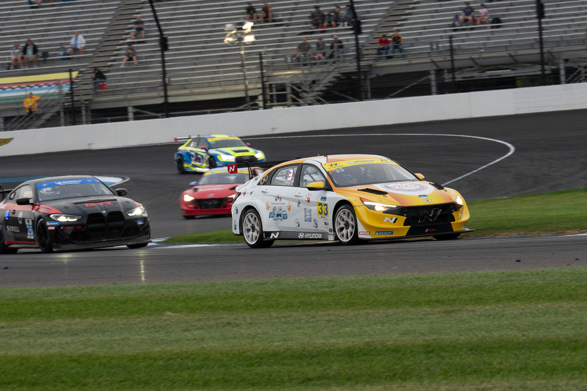 The number 33 car leading the pack through the "S" turns.
