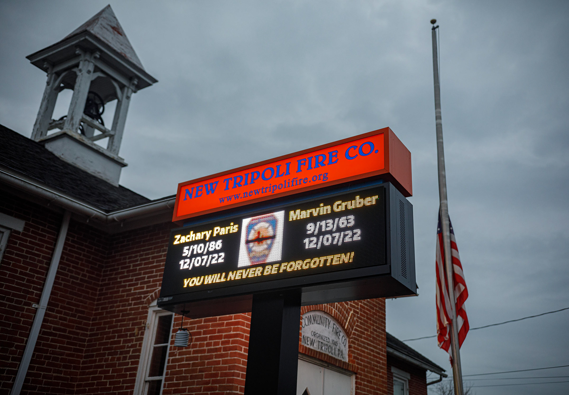One year later, a candlelight vigil is held Thursday, Dec. 7, 2023, for fallen firefighters Zachary Paris and Marvin Gruber outside New Tripoli Fire Station Thursday, Dec. 7, 2023, in Lynn Township.  Paris and Gruber died in the line of duty while fighting a house fire Dec. 7, 2022, in West Penn Township, Schuylkill County. (Jane Therese/Special to The Morning Call)