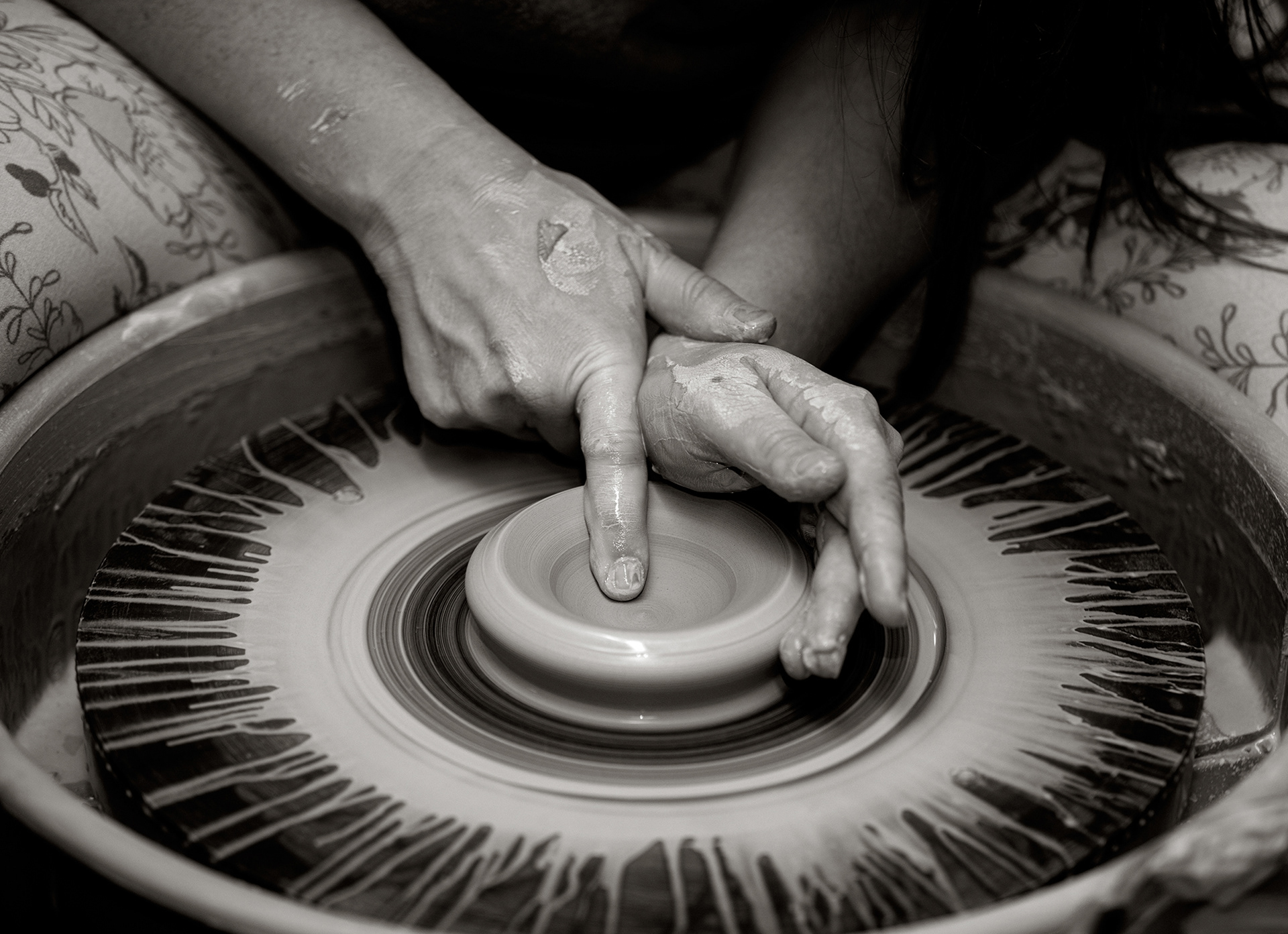 Potter Ashlynn Zulinski at her potter’s wheel in Dover Saturday, September 19, 2020 in Delaware. “To me, work means getting out of bed every single morning loving what you’re doing to create a life for yourself.” Says Zulinski. “I’ve learned over the years that life slows down for no one. I have endured multiple lifetimes of poverty, tragedy, heartbreak and loss. For a long time, I let those things define who I was as a person and I allowed those emotions to run my life for me. Today, I'm at the realization, that if I do not get up every single day with the purpose and intent on creating a beautiful and better life for myself, I will never have the life I want. Tragedies happen, hearts get broken, and we lose people we love often. My artwork gives me purpose and beauty at once. My work means I am able to share my gift while using this form of creative therapy to shape my future into something I desire.” (Photo by Jane Therese)