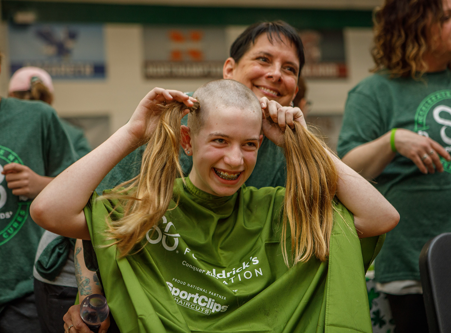 Sierah Heiserman, 12, of Zionsville has her head shaved by Joni Laundry of Emmaus on Friday, April 26, 2024, during the Emmaus Shave the Brave fundraiser at Emmaus High School in Emmaus. The event, intended to help raise money for children battling cancer, was sponsored by the St. Baldrick’s Foundation. (Jane Therese / Special to The Morning Call)