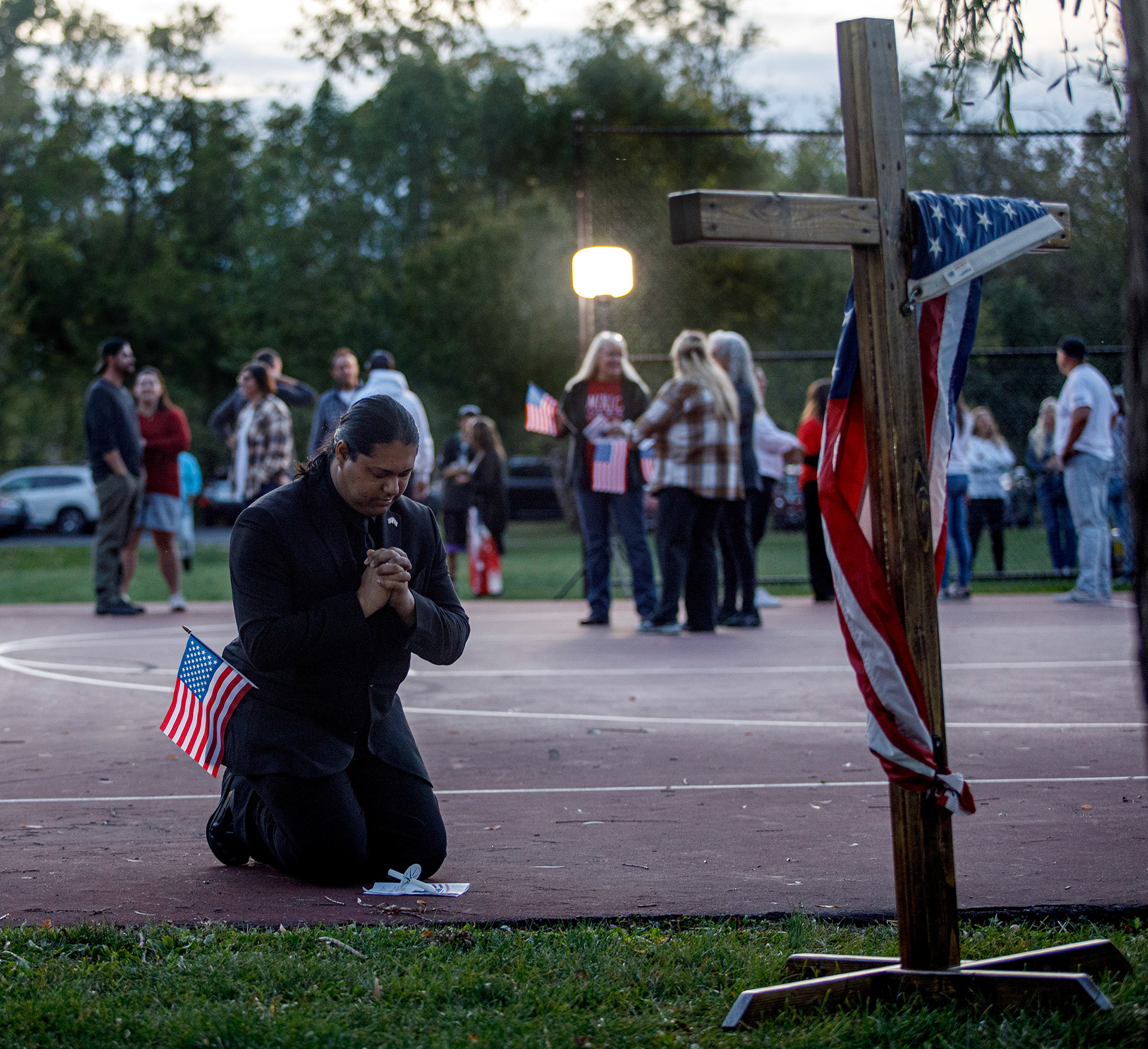 People attend a candelight vigil in memory of slain conservative political activist Charlie Kirk