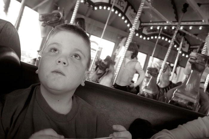 Drew riding the carousel