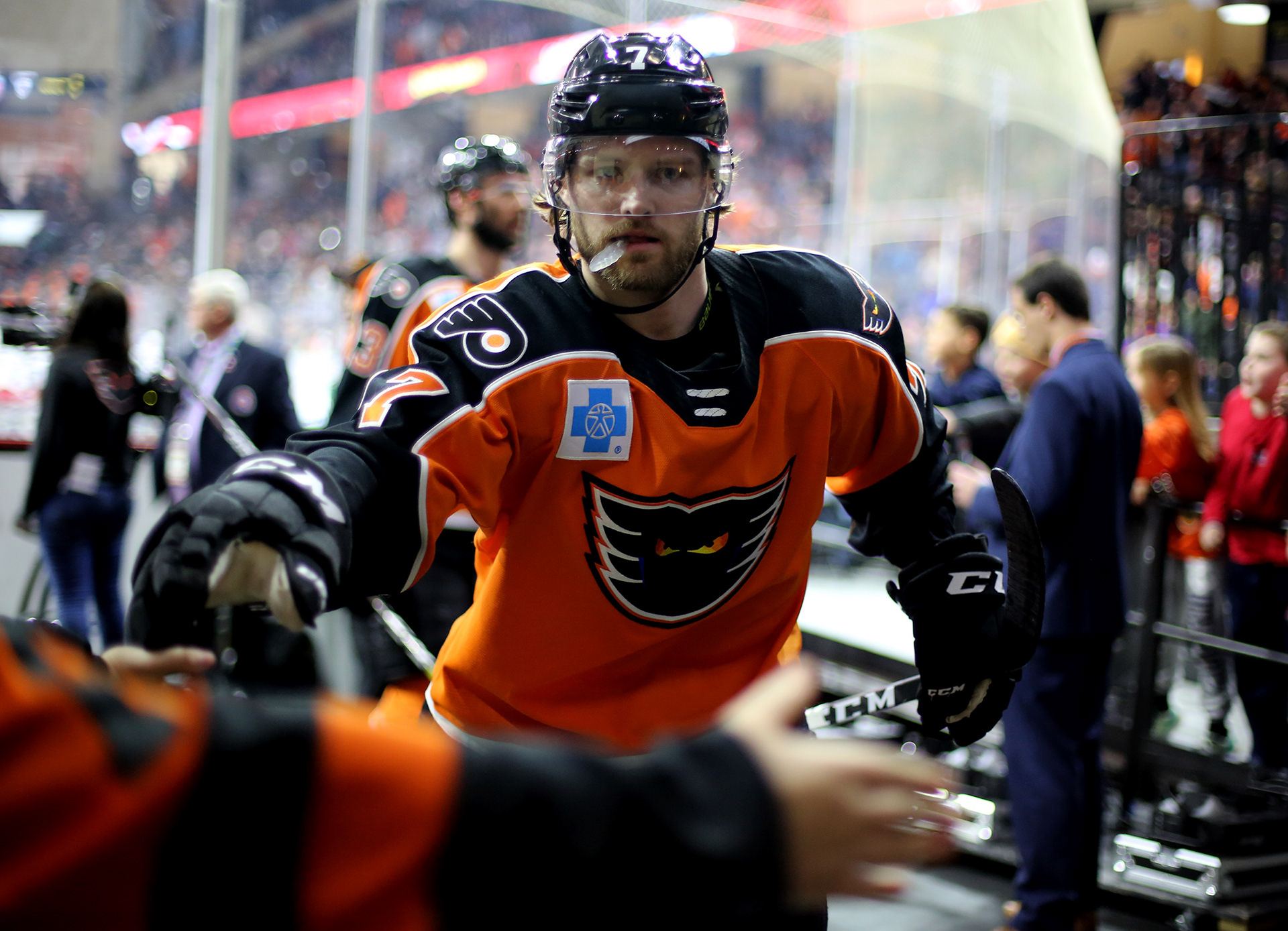 PHANTOMS COLE BARDREAU TAKES TIME TO HIGH FIVE A FAN BEFORE HEADING INTO THE LOCKER ROOM AT THE PPL CENTER IN ALLENTOWN.