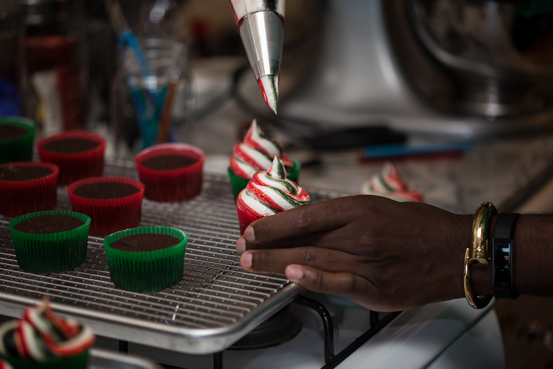 Buki Elegbede of “The Buki Show,” bakes homemade chocolate candy cane swirl cupcakes for the holiday season in Newark. (Jane Therese for Edible New Jersey)