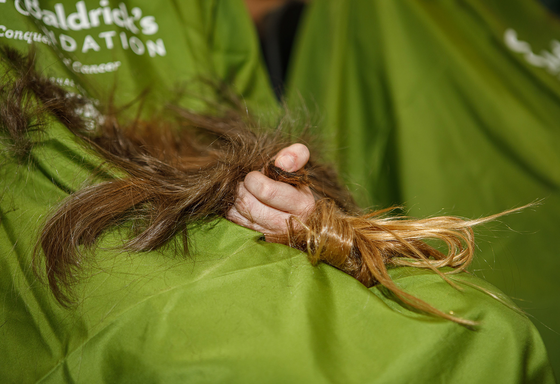 Sierah Heiserman, 12, of Zionsville has her head shaved by Joni Laundry of Emmaus on Friday, April 26, 2024, during the Emmaus Shave the Brave fundraiser at Emmaus High School in Emmaus. The event, intended to help raise money for children battling cancer, was sponsored by the St. Baldrick’s Foundation. (Jane Therese / Special to The Morning Call)