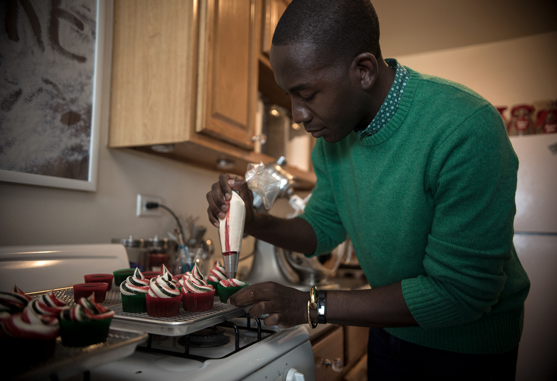 Buki Elegbede of “The Buki Show,” bakes homemade chocolate candy cane swirl cupcakes for the holiday season in Newark. (Jane Therese for Edible New Jersey)