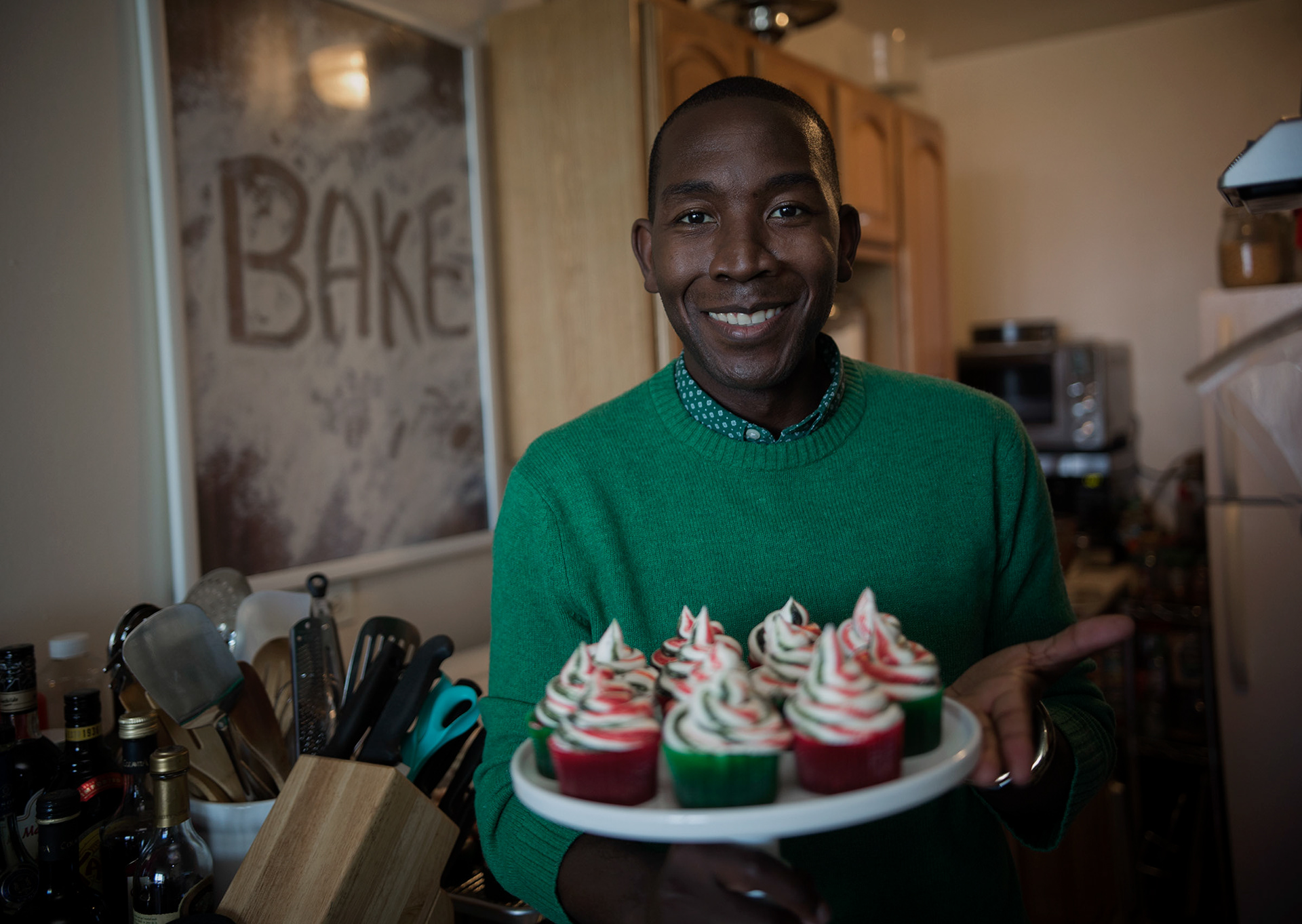 Buki Elegbede of “The Buki Show,” bakes homemade chocolate candy cane swirl cupcakes for the holiday season in Newark. (Jane Therese for Edible New Jersey)