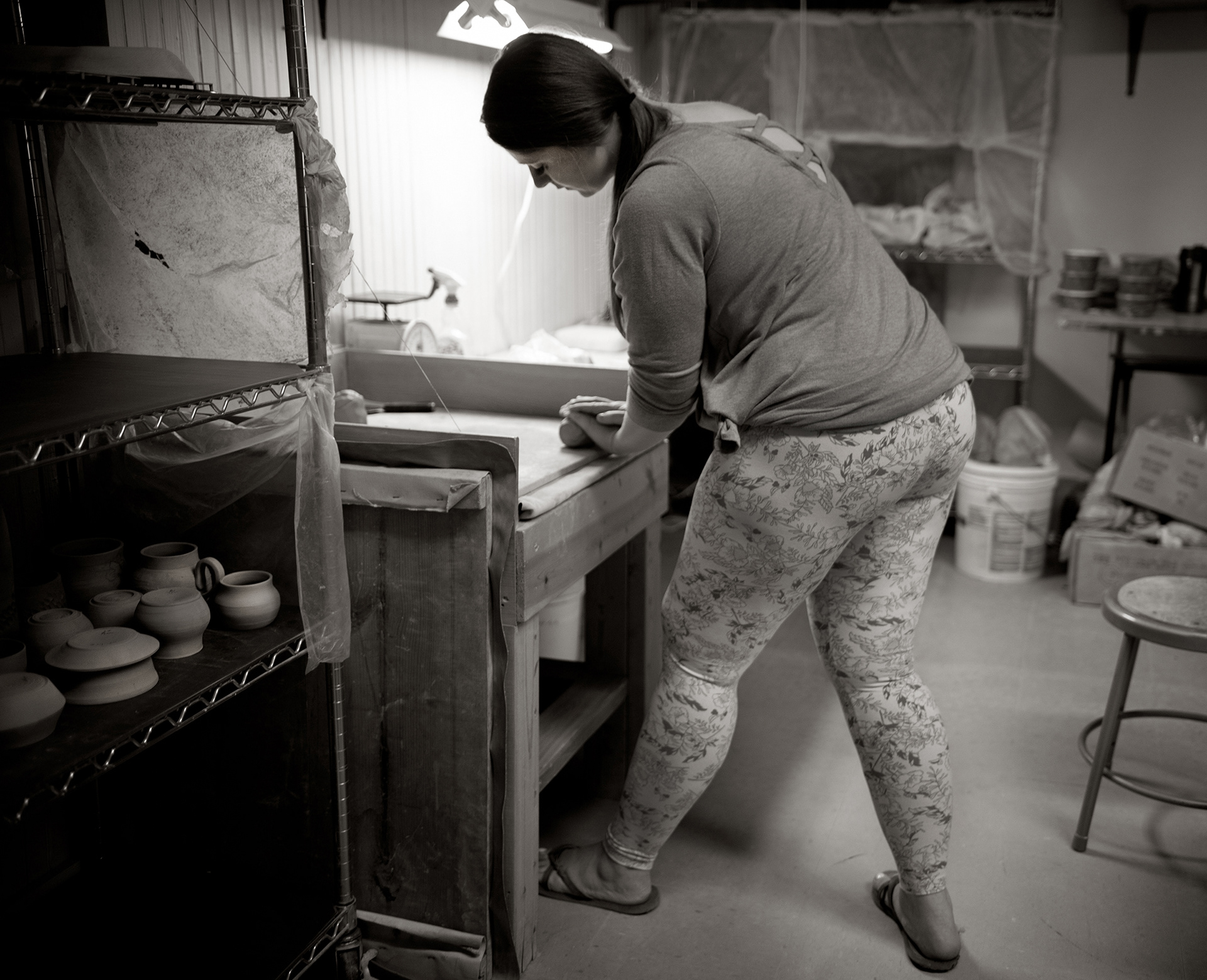 Potter Ashlynn Zulinski at her potter’s wheel in Dover Saturday, September 19, 2020 in Delaware. “To me, work means getting out of bed every single morning loving what you’re doing to create a life for yourself.” Says Zulinski. “I’ve learned over the years that life slows down for no one. I have endured multiple lifetimes of poverty, tragedy, heartbreak and loss. For a long time, I let those things define who I was as a person and I allowed those emotions to run my life for me. Today, I'm at the realization, that if I do not get up every single day with the purpose and intent on creating a beautiful and better life for myself, I will never have the life I want. Tragedies happen, hearts get broken, and we lose people we love often. My artwork gives me purpose and beauty at once. My work means I am able to share my gift while using this form of creative therapy to shape my future into something I desire.” (Photo by Jane Therese)