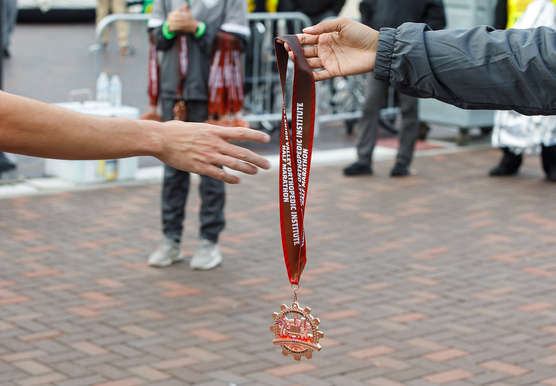 Dieruff cheerleading squad volunteered to hand medals out to finishers of the Lehigh Valley Orthopedic Institute Half Marathon Sunday, Oct. 22, 2023, at SteelStacks in Bethlehem.