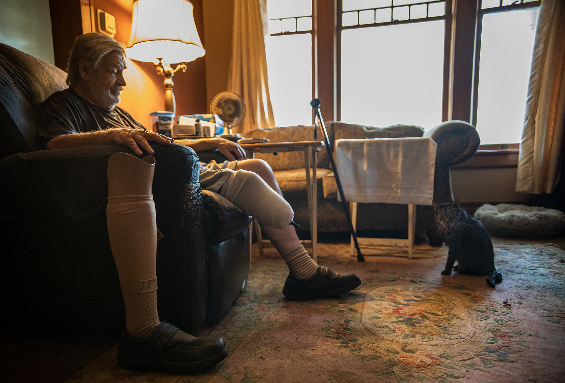 Ken Johnson with his senior cat, Tully, in Easton on Thursday June 30, 2022. Johnson adopted Tully from the FURR program which matches seniors with senior cats to adopt. 