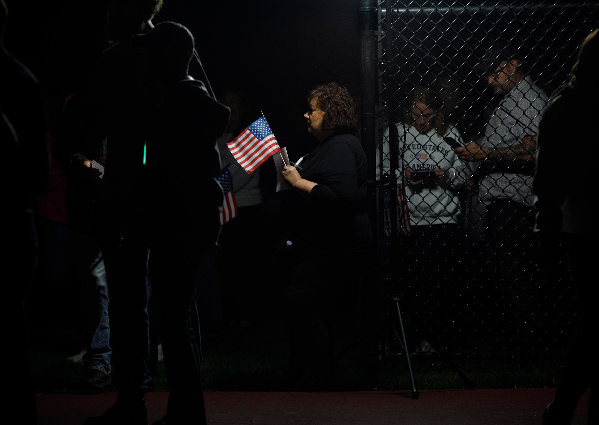 People attend a candelight vigil in memory of slain conservative political activist Charlie Kirk