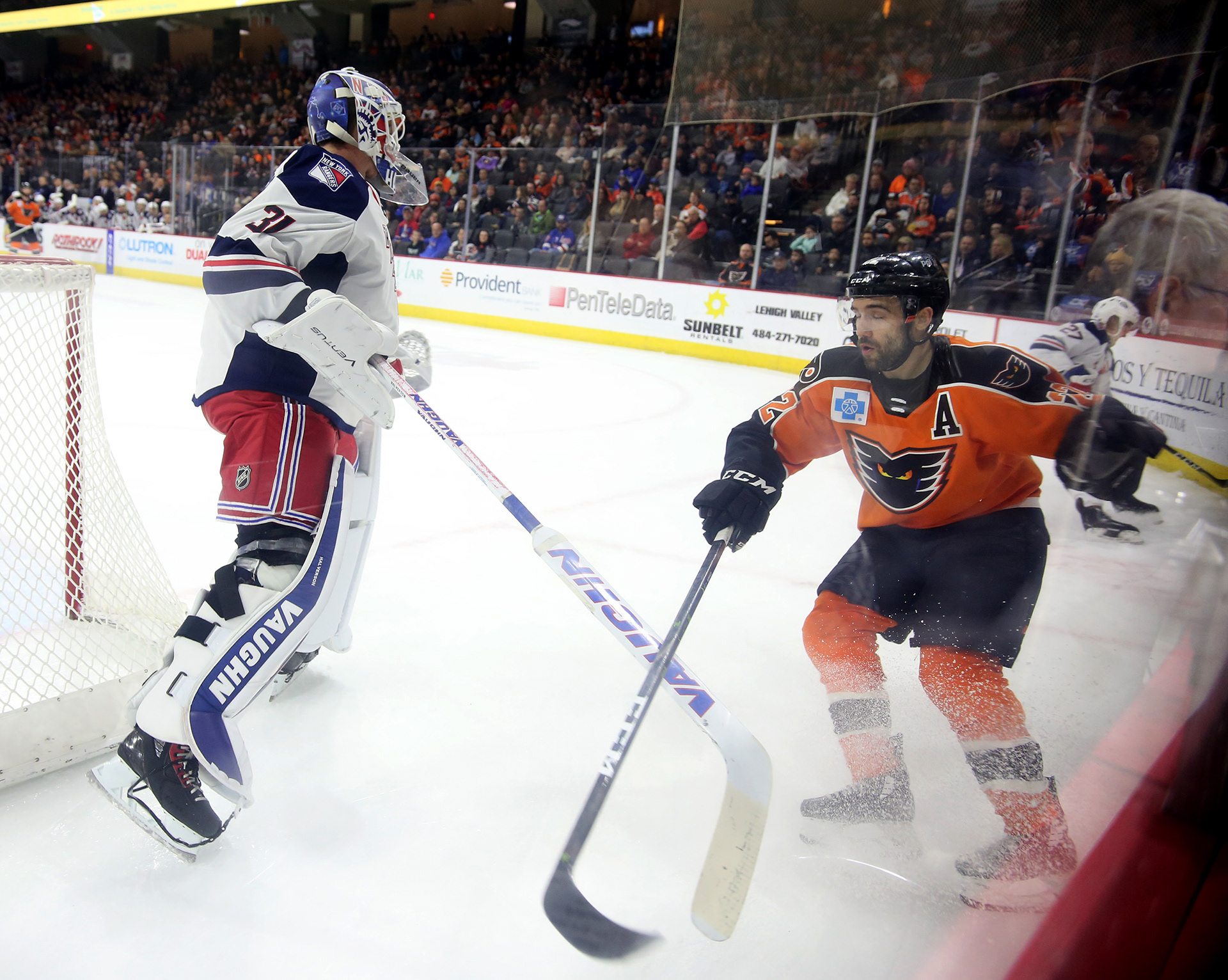 PHANTOMS COLIN MCDONALDAND HARTFORD'S GOALIE BRANDON HALVERSON SCRAMBLE FOR THE PUCK AT THE PPL CENTER IN ALLENTOWN.