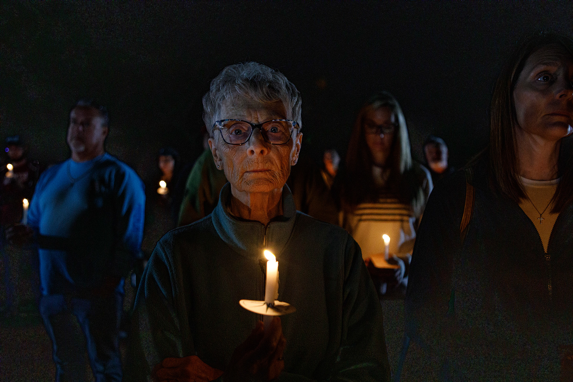 People attend a candelight vigil in memory of slain conservative political activist Charlie Kirk