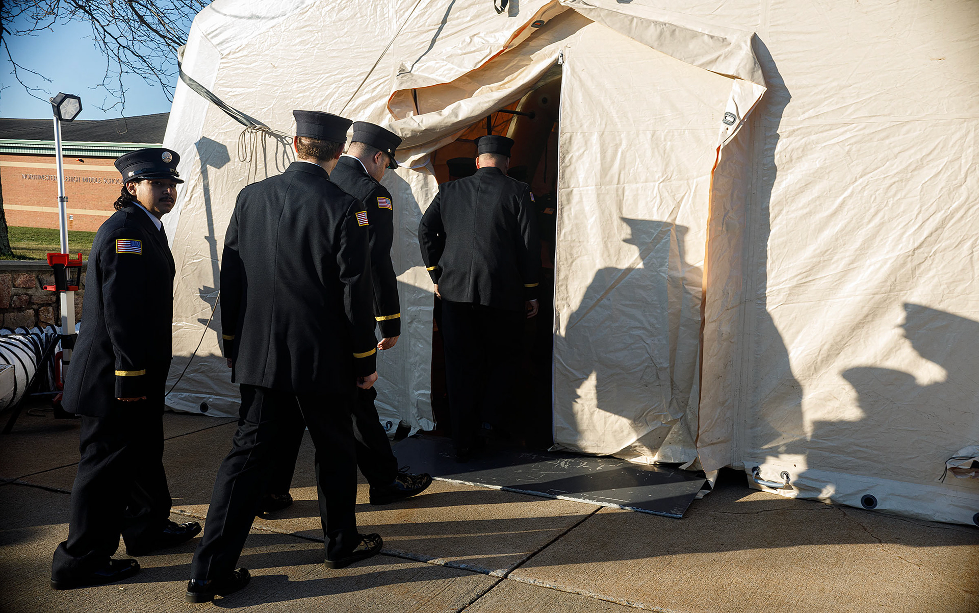 Firefighters arrive for a public viewing for Community Fire Company of Tripoli firefighters Zachary Paris and Marvin Gruber at Northwestern Lehigh Middle School Saturday December 17, 2022 in New Tripoli. Paris and Gruber were killed December 7th  in the line of duty in a fire in Schuylkill Township. (Jane Therese/ Special to The Morning Call)