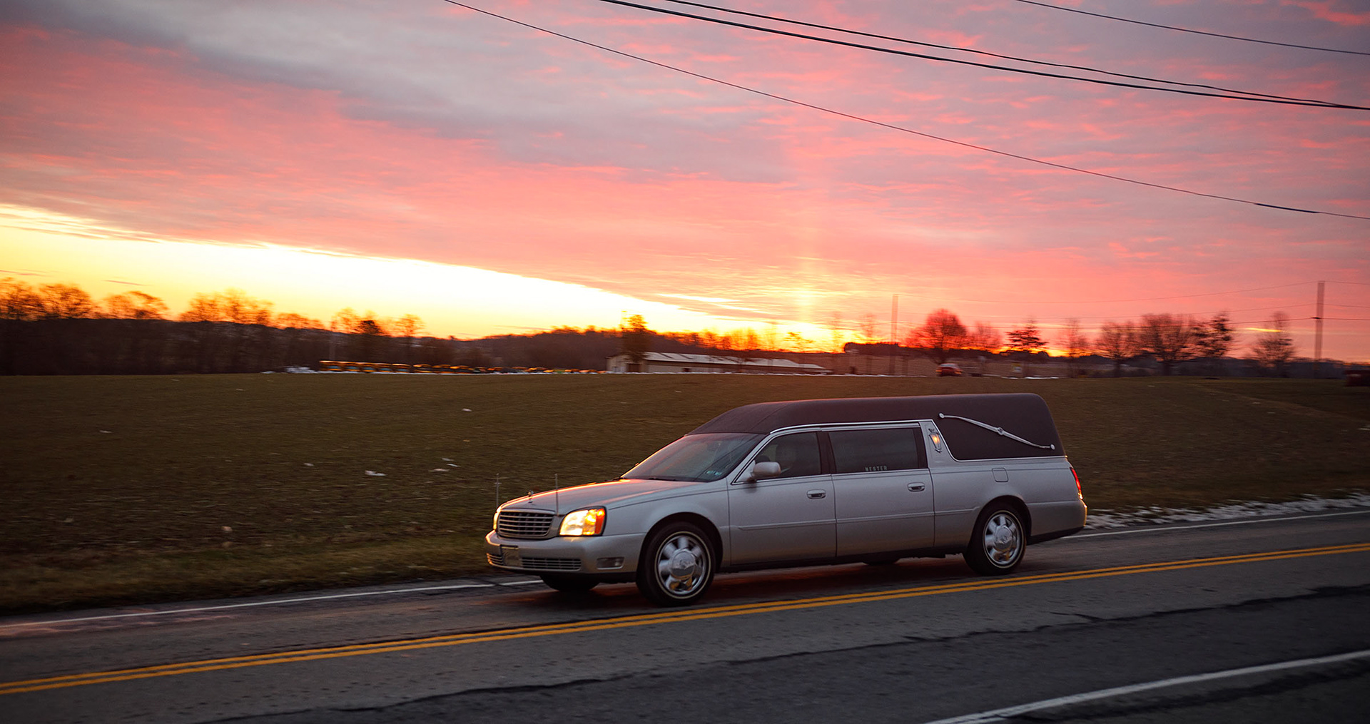 An empty hearse on its way to gather coffins, passes by during public viewing for Community Fire Company of Tripoli firefighters Zachary Paris and Marvin Gruber at Northwestern Lehigh Middle School Saturday December 17, 2022 in New Tripoli. Paris and Gruber were killed December 7th  in the line of duty in a fire in Schuylkill Township. (Jane Therese/Special to The Morning Call)