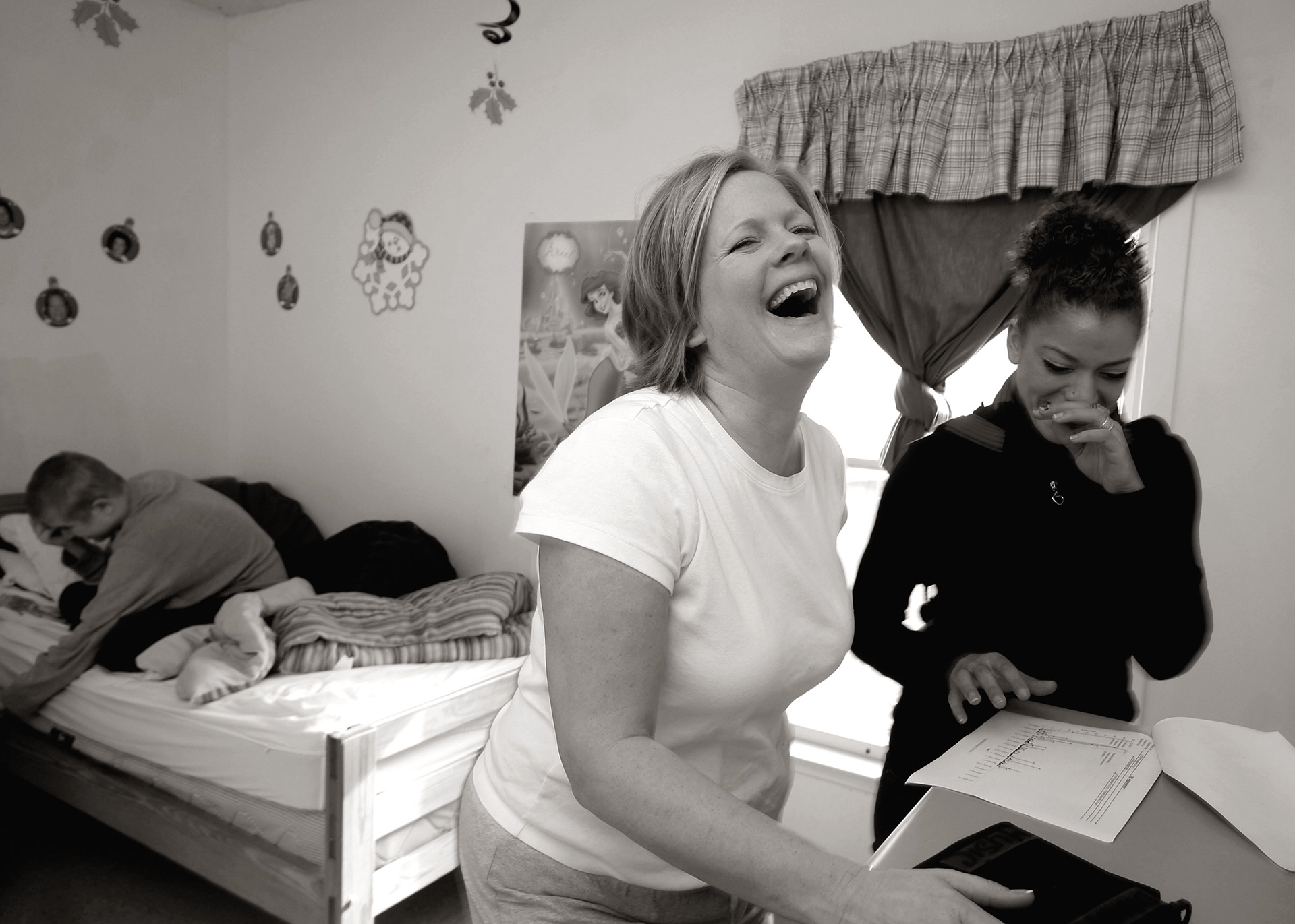 Jill laughs with Danny's case worker at bancroft