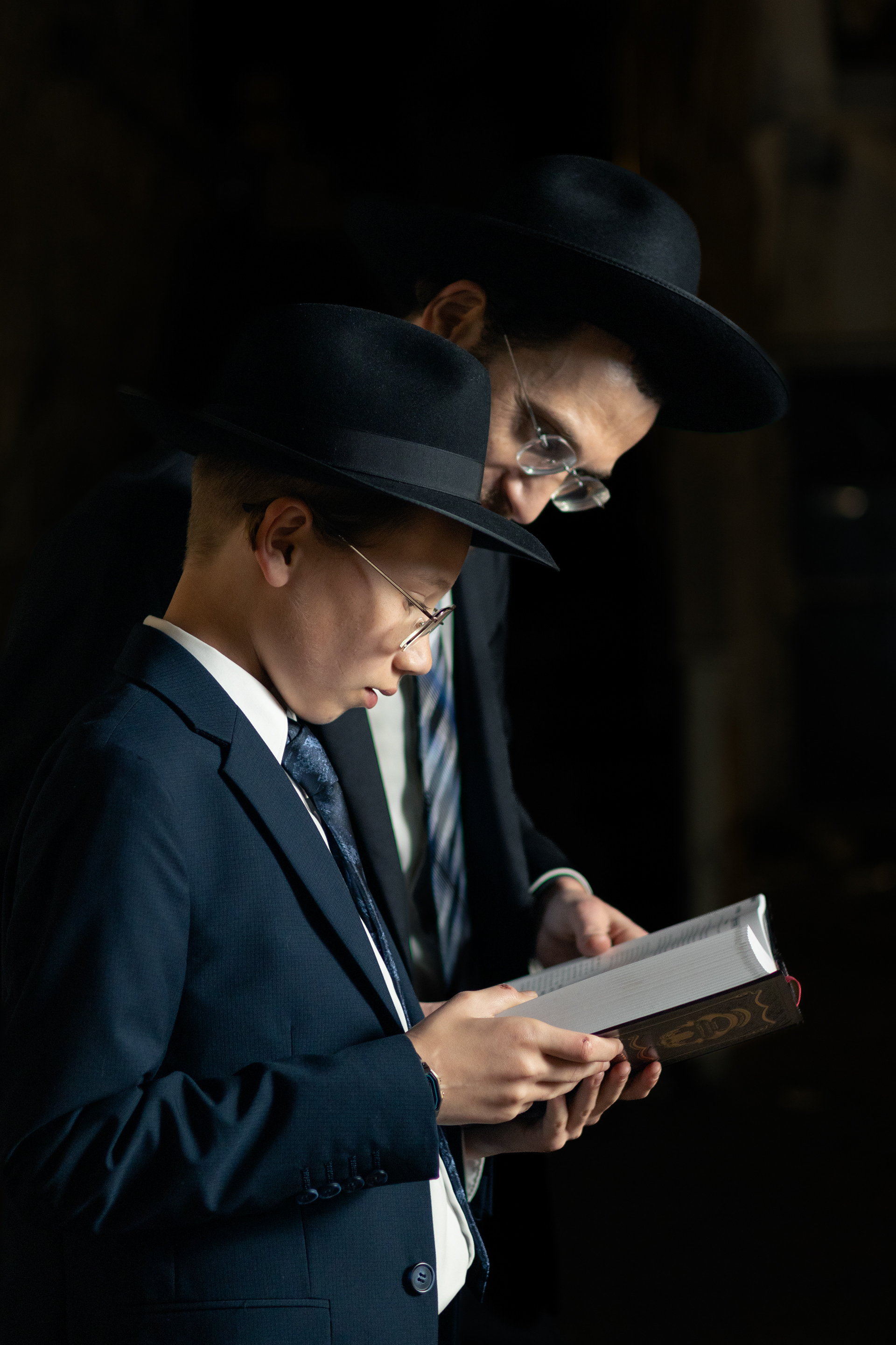 bar mitzva boy and father learning