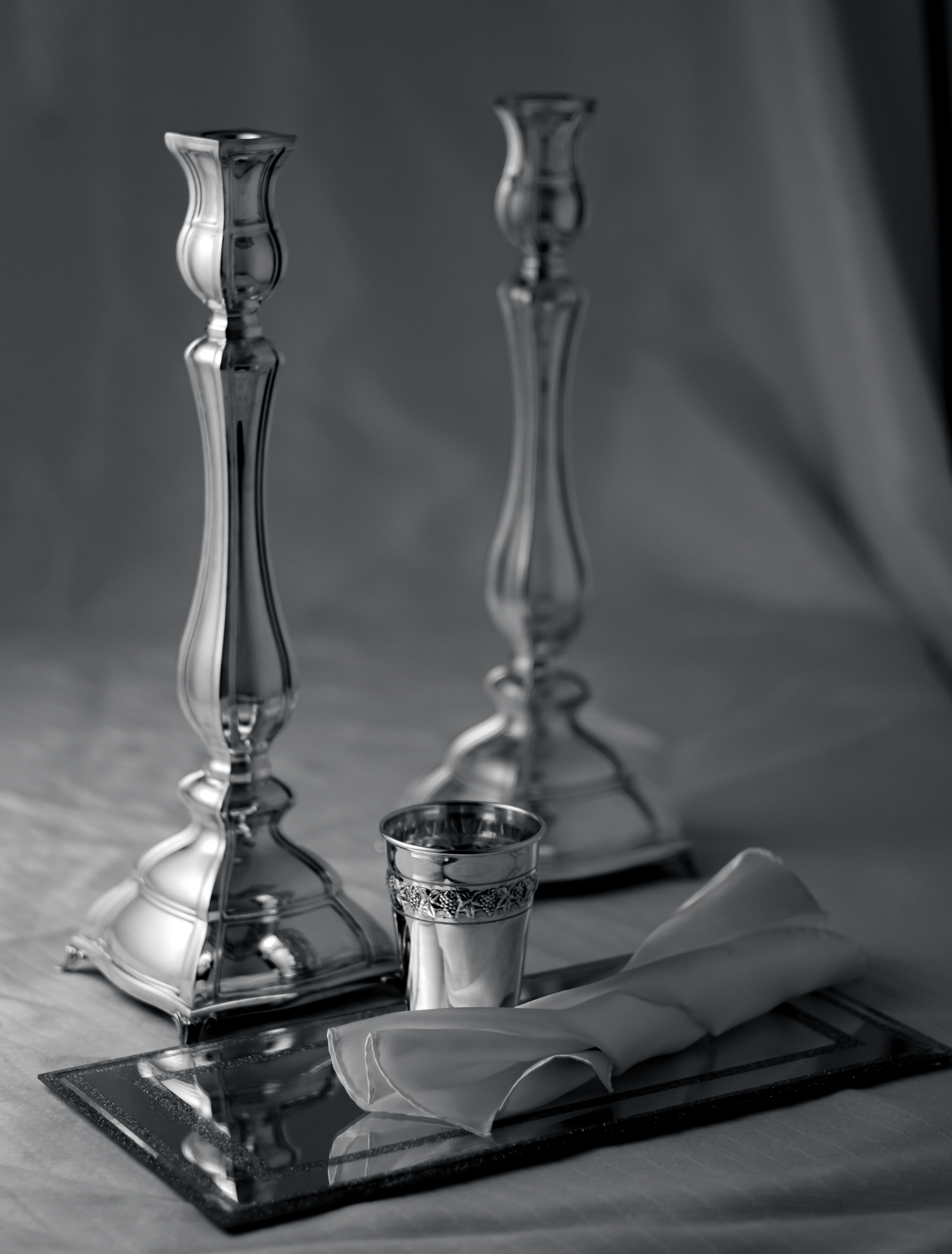 Silver Candlesticks and cup set with white background