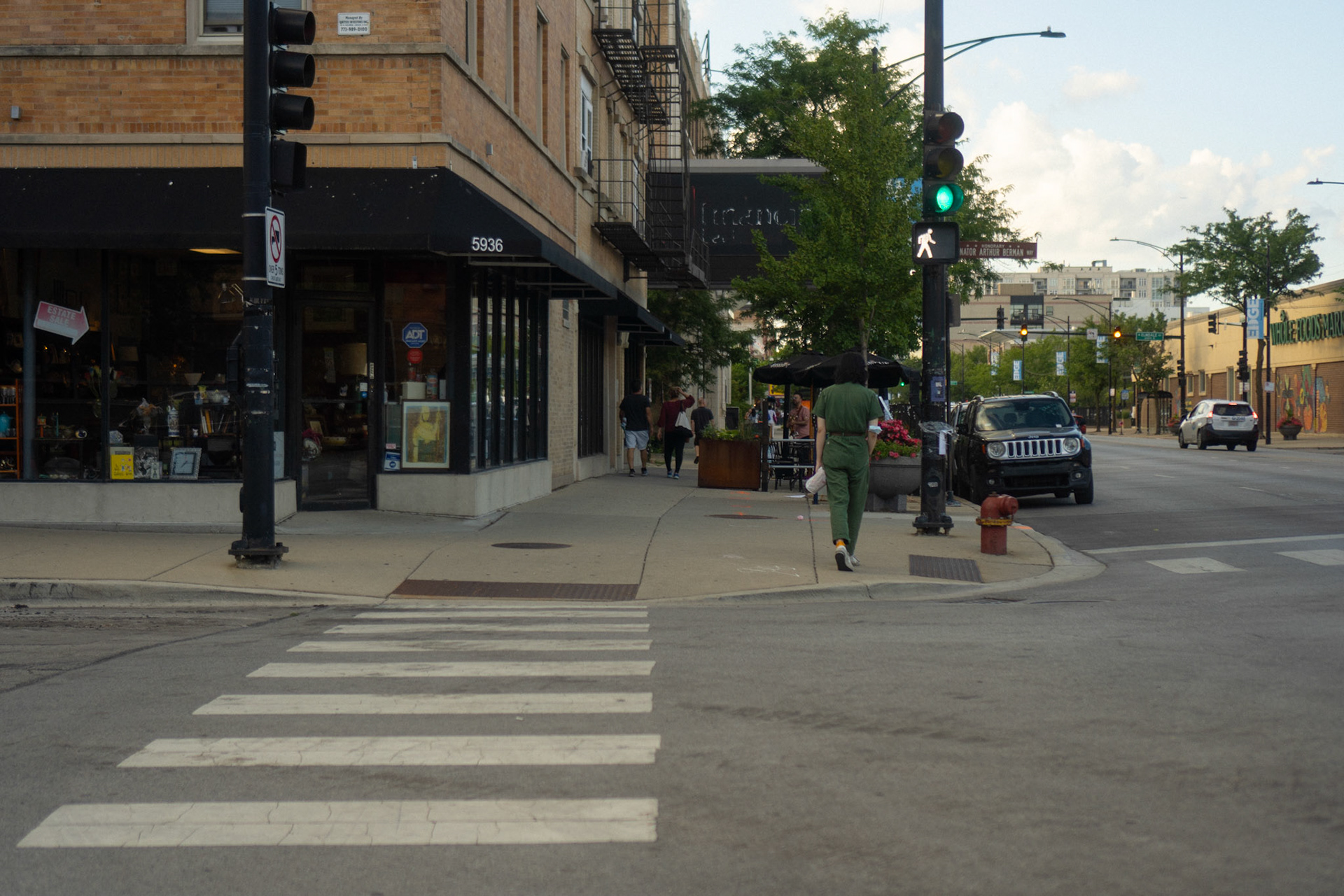 Across the street the young woman in green stood out to me.