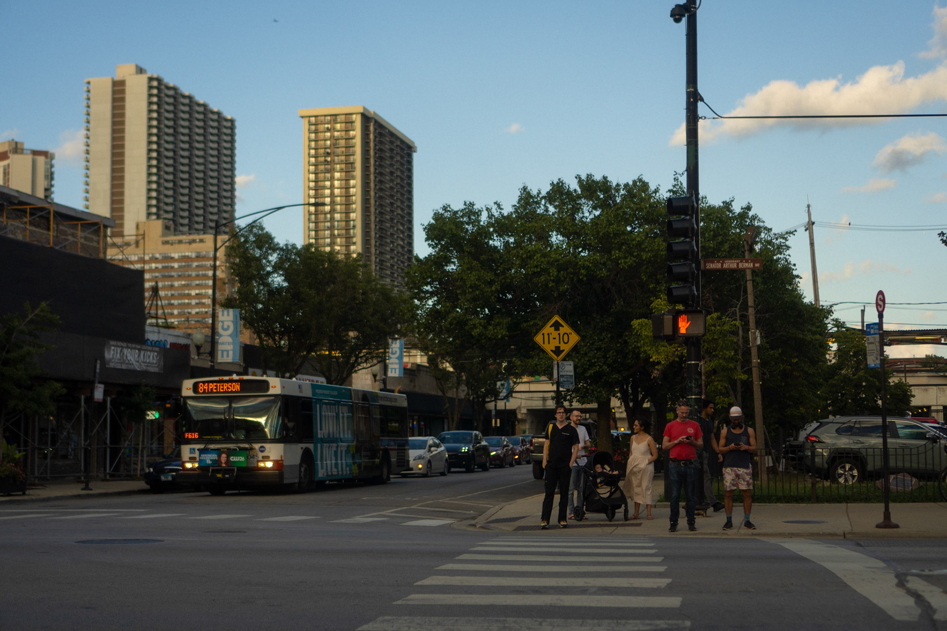 People waiting to cross the street.
