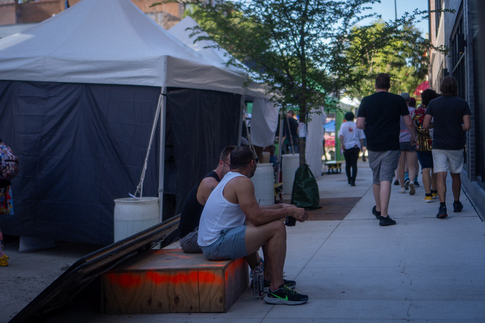 candid - friends chatting - love the orange on the wooden crate here